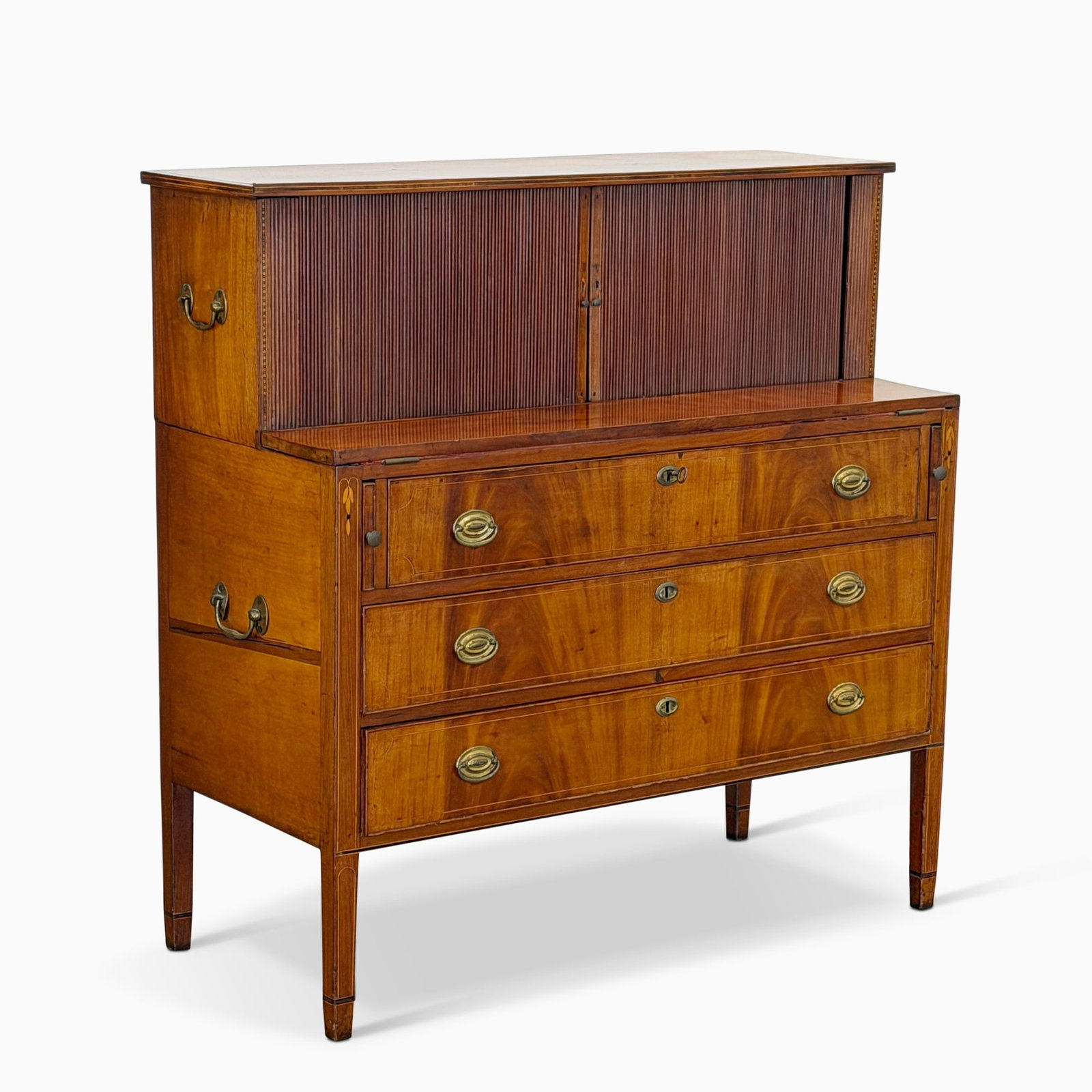 The Paul Revere Federal Inlaid Mahogany Tambour Desk: Probably Boston, Massachusetts, circa 1795 The upper section with two tambour doors opening to a compartmented and multi-drawer interior, set into lower section with red baise-lined fold-down writing 