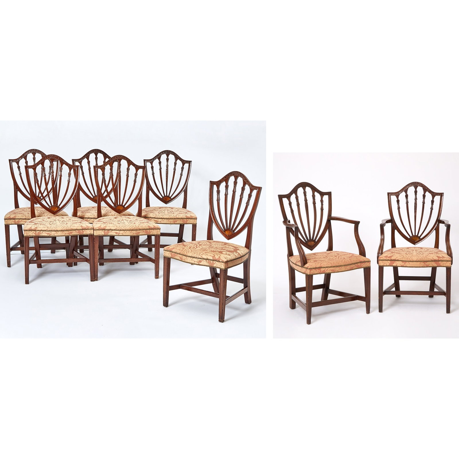 Set of Eight Federal Mahogany Shieldback Dining Chairs: The carving possibly the work of Samuel McIntire, Salem, Massachusetts, 1790-1810 Comprising two arm chairs and six side chairs, each back with carved crestrail centering a basket of flowers with trai