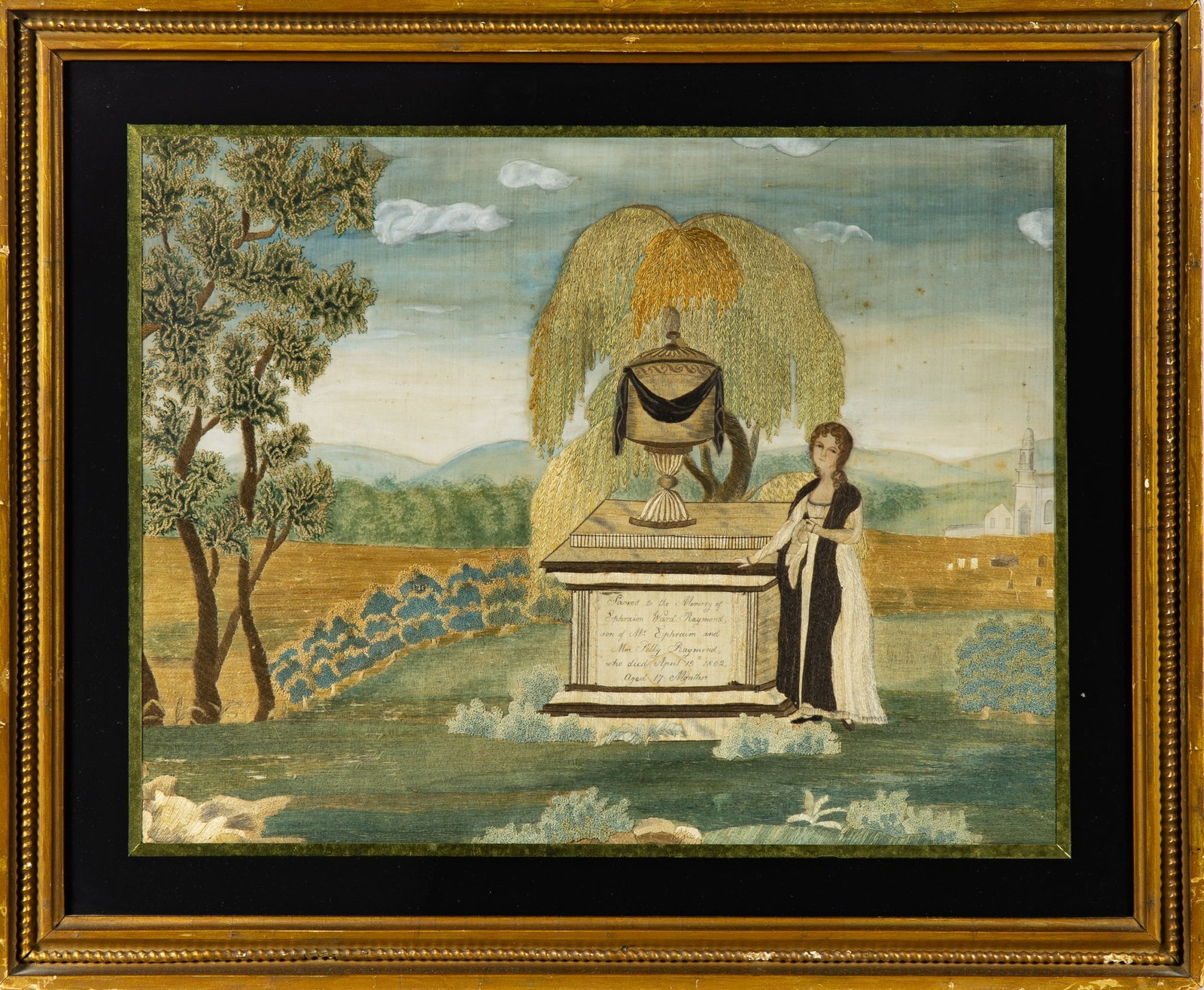 Silk-Embroidered, Painted, and Eglomise Mourning Picture: Probably Massachusetts, early 19th Century Worked in silk threads on a silk ground, a figure next to an urn-topped monument lettered in part "Sacred to the Memory of Ephraim Ward Raymond and Mrs.