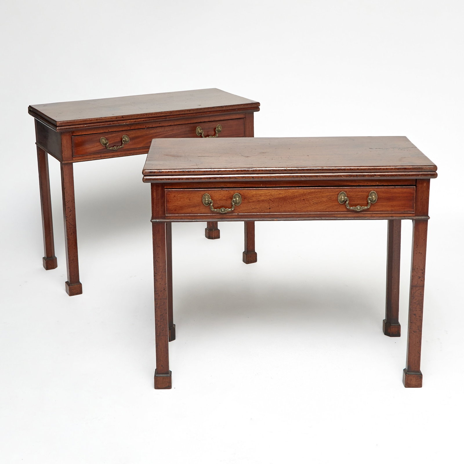 Pair of Chippendale Walnut Card Tables: Pennsylvania, late 18th century Each with cockbeaded frieze drawer above square legs with interior chamfer ending in blocked feet. Height 29 inches, width 35 inches, depth 17 1/4 inches.