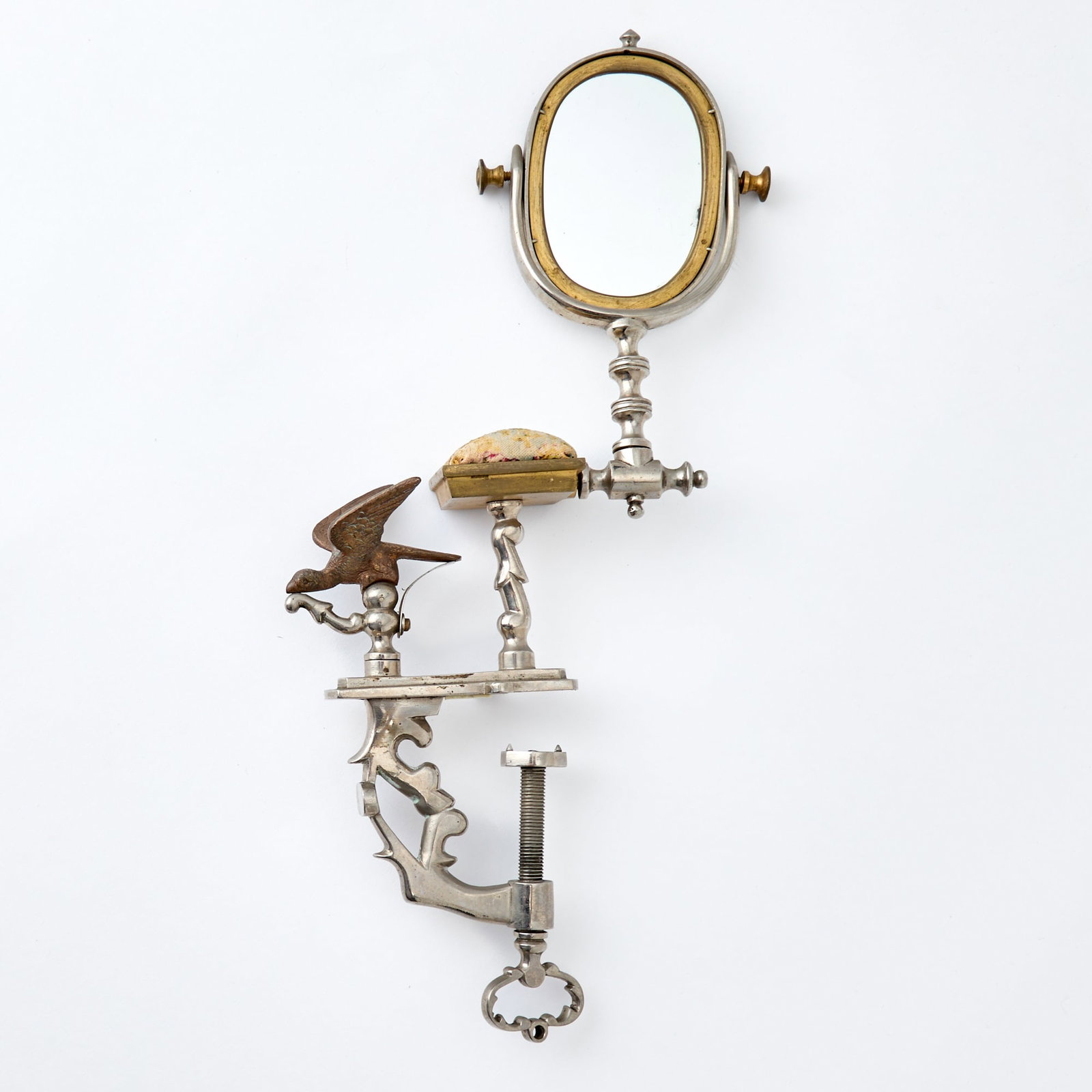 Steel and Brass Sewing Clamp with Mirror: Second half 19th century Height 12 1/2 inches.