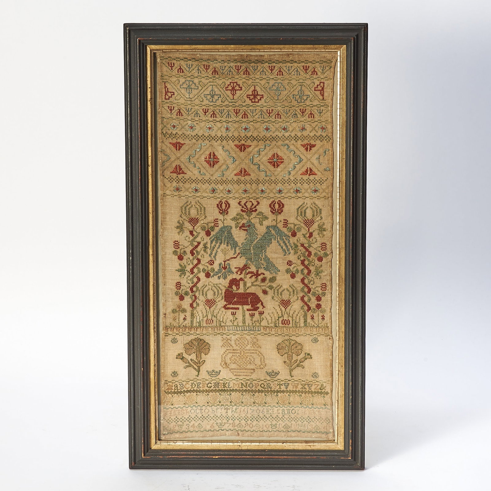 Needlework Band Sampler "Eleanor Jenks": England, 1706 Worked in silk threads on a linen ground, composed of floral and geometric bands above a central pictorial register with spreadwinged pelican and her chicks among floral motifs, all abov
