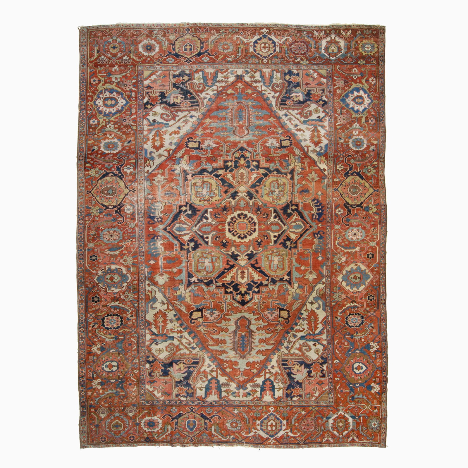 Heriz Carpet: Northwest Persia, circa 1900 The central geometric medallion on the madder field flanked by ivory spandrels is within a palmette and vine border. (13' 1" x 9' 6")