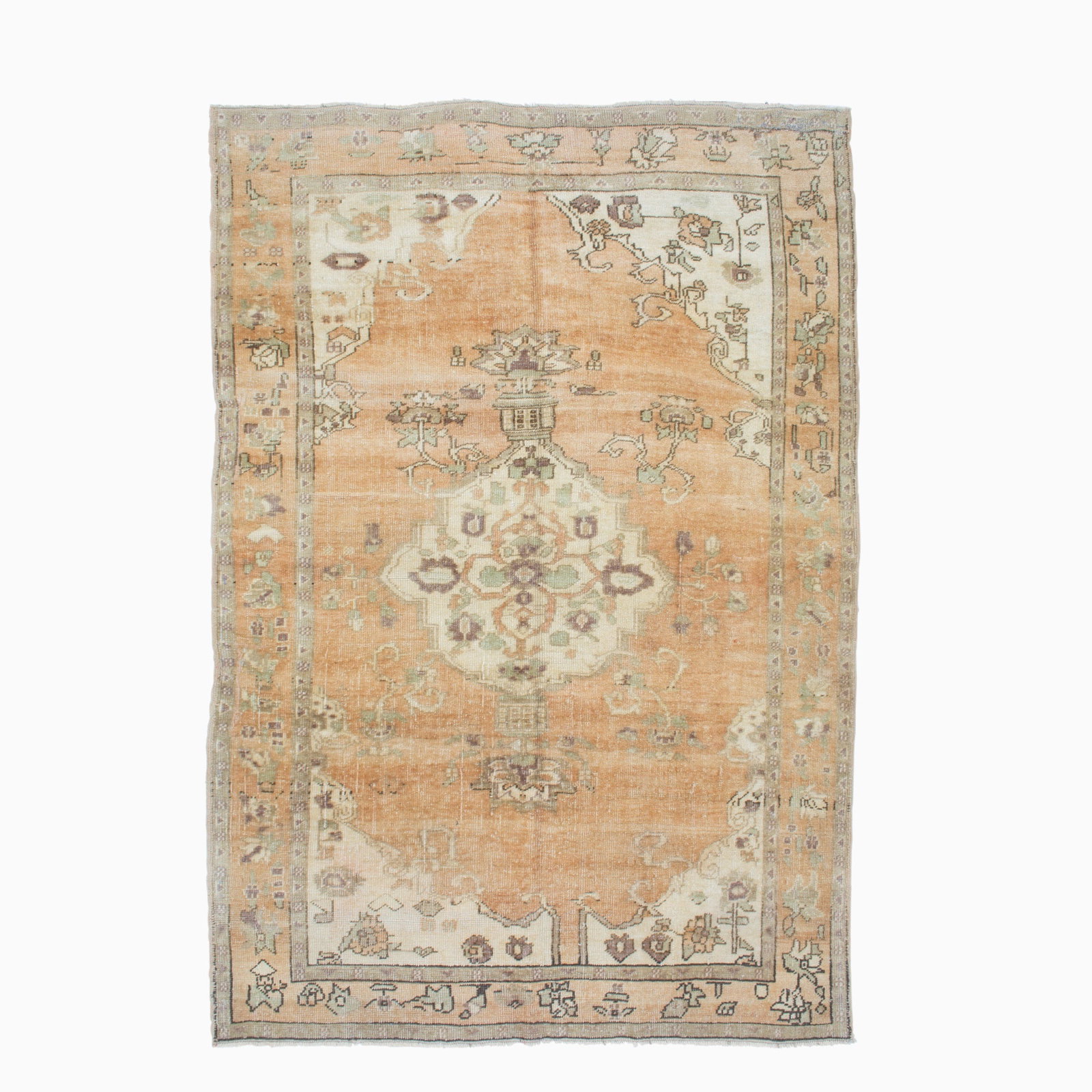 Oushak Rug: West Turkey, Mid-20th Century The central pendant medallion on the camel field flanked by ivory spandrels is within a floral vinery border. (7' 7" x 5' 4")