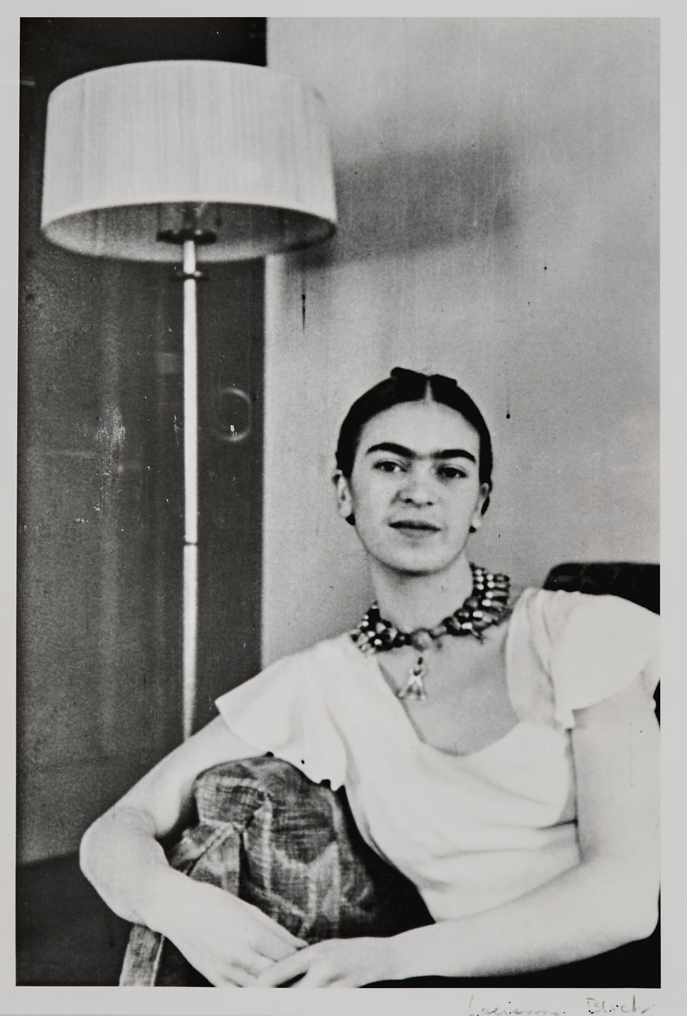 Lucienne Bloch, Frida by the Lamp. 1931: BLOCH, LUCIENNE Frida by the Lamp. 1931, printed 1997. Gelatin silver print, 11 7/8 x 7 7/8 inches (301 x 198 mm) on larger sheet, signed in black recto (margin l.r.). Framed.