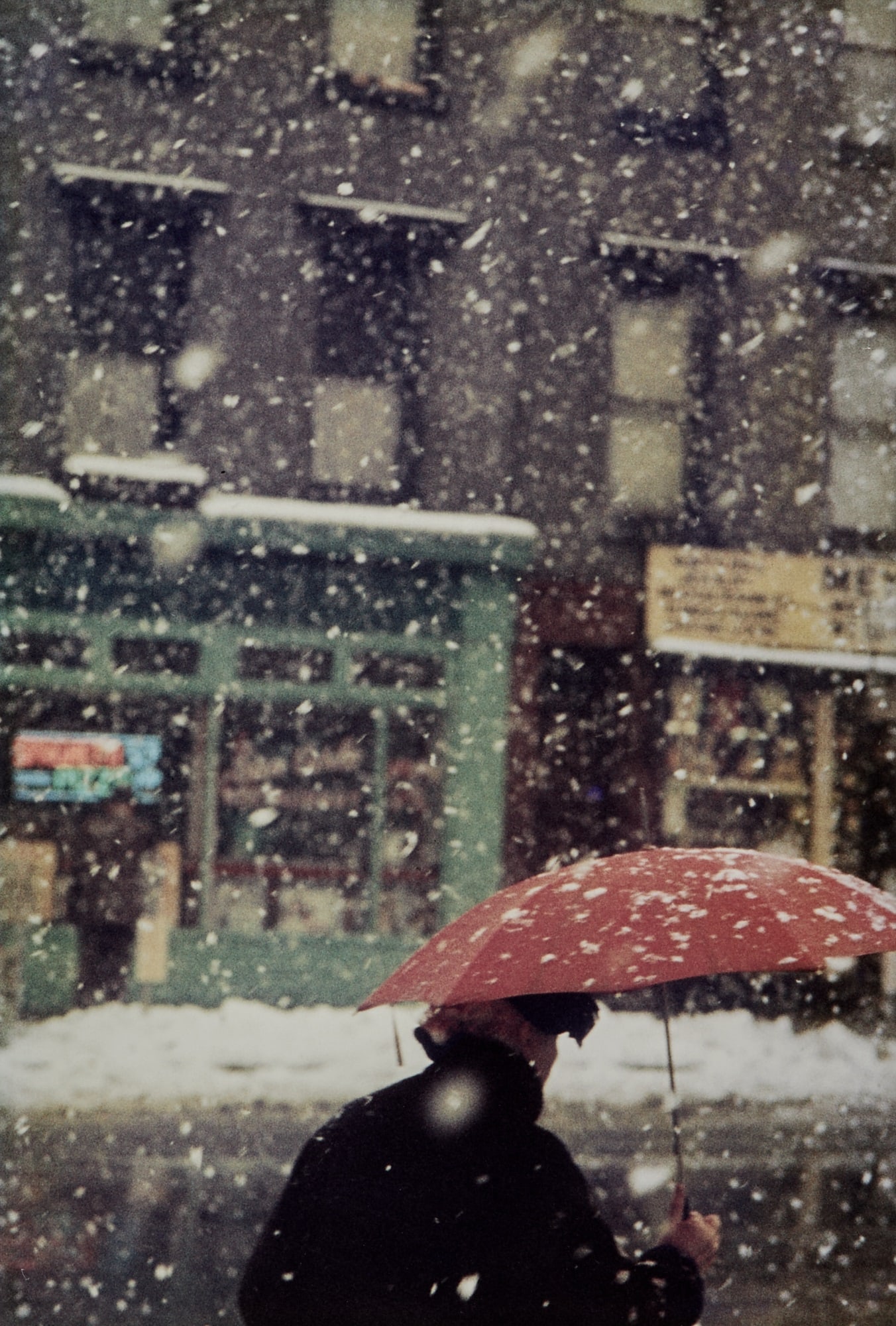 Saul Leiter, Untitled (woman with umbrella in snow storm), circa 1955: LEITER, SAUL (1923-2013) Untitled (woman with umbrella in snow storm), circa 1955, printed later. Chromogenic print, 19 1/2 x 13 1/4 inches (492 x 332 mm) on 20 x 16 inches sheet, numbered 3 from an e