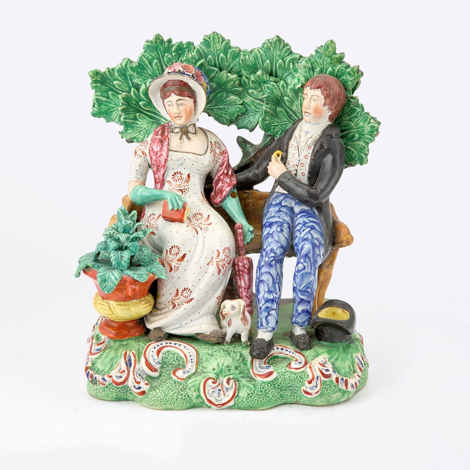 Staffordshire Pearlware Group of 'Persuasion': Circa 1825-1830 The courting couple modeled seated before a bocage on a scroll-molded rectangular base. Height 8 1/2 inches. Provenance: Jonathan Horne Antiques