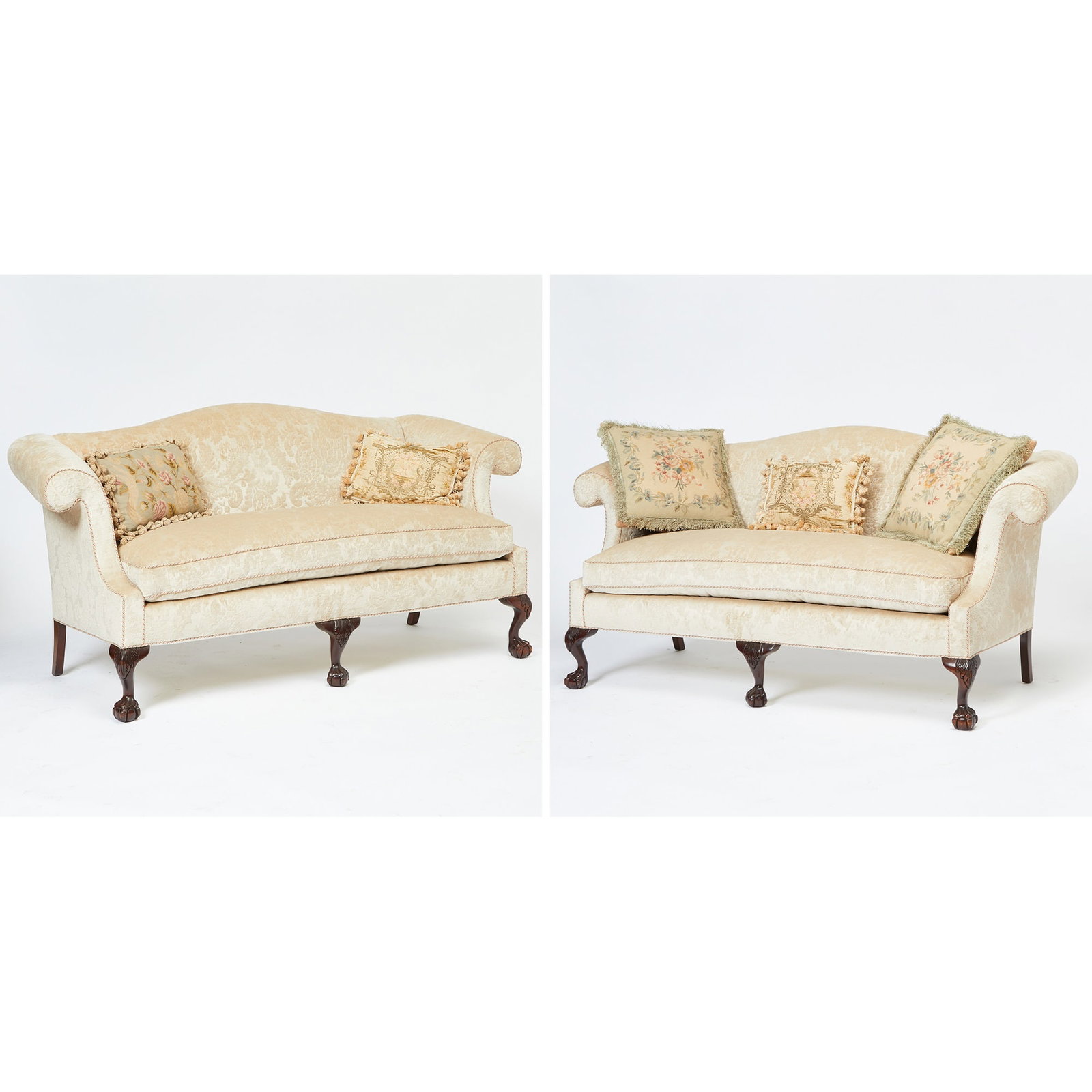Pair of Chippendale Style Upholstered Mahogany Settees: Height 35 1/2 inches, width 6 feet 5 inches, depth of seat 21 inches.