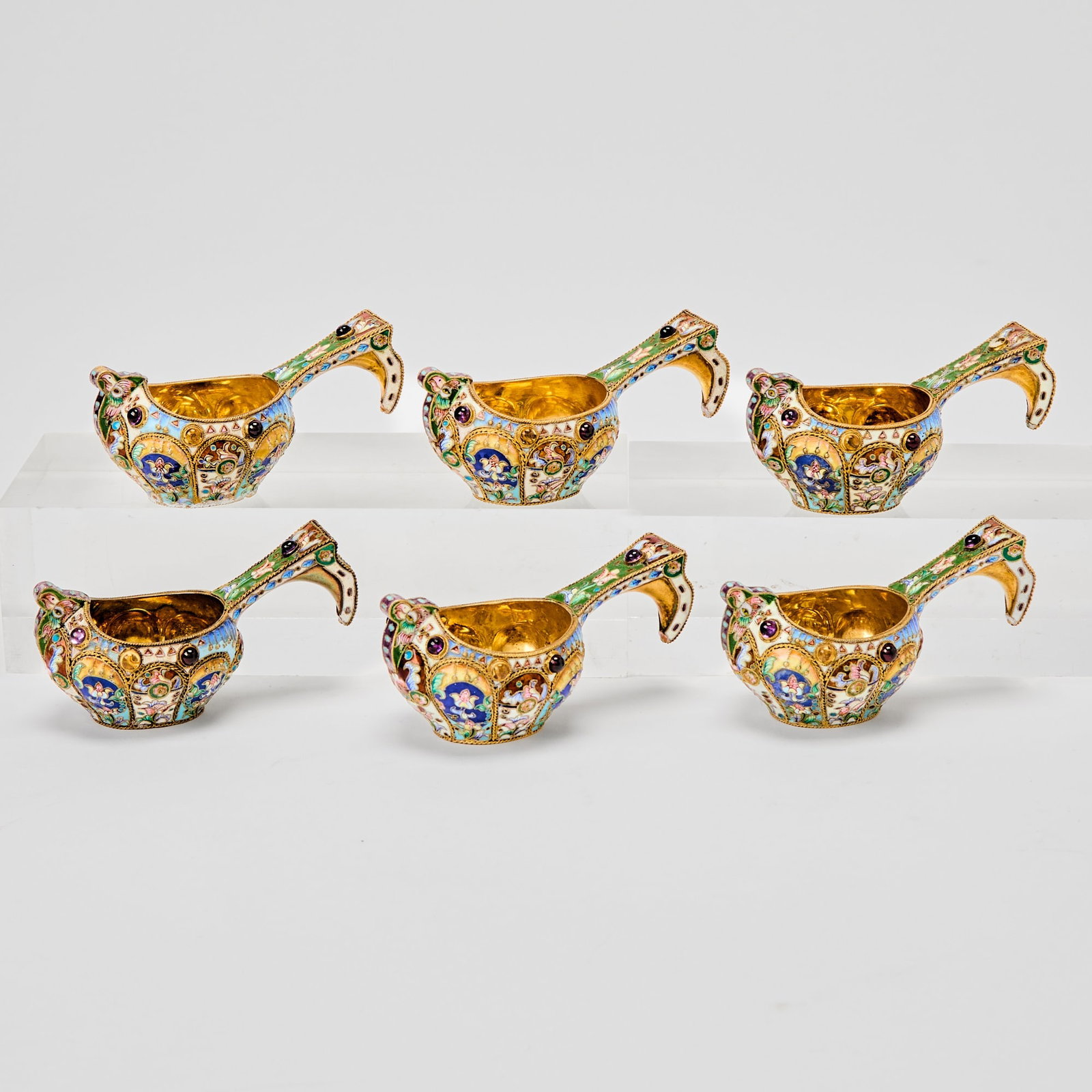 Set of Six Russian Style Silver-Gilt and Cloisonn? Enamel Kovshi: Late 20th century Length 3 3/4 inches.