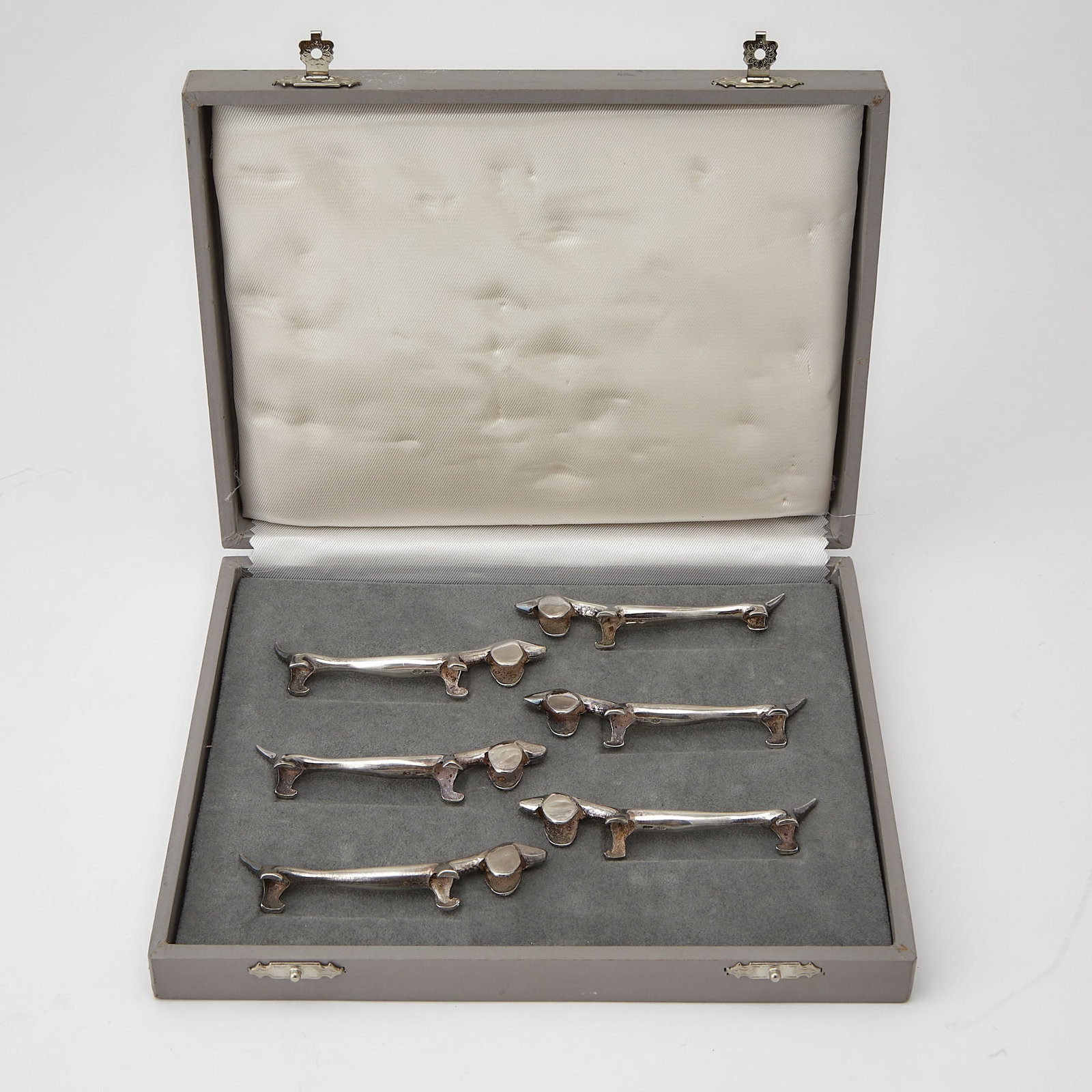Cased Set of Six Italian Sterling Silver Novelty Knife Rests: Late 20th century Each in the form of a dachshund. Length 3 1/4 inches, total approximately 4 ounces.