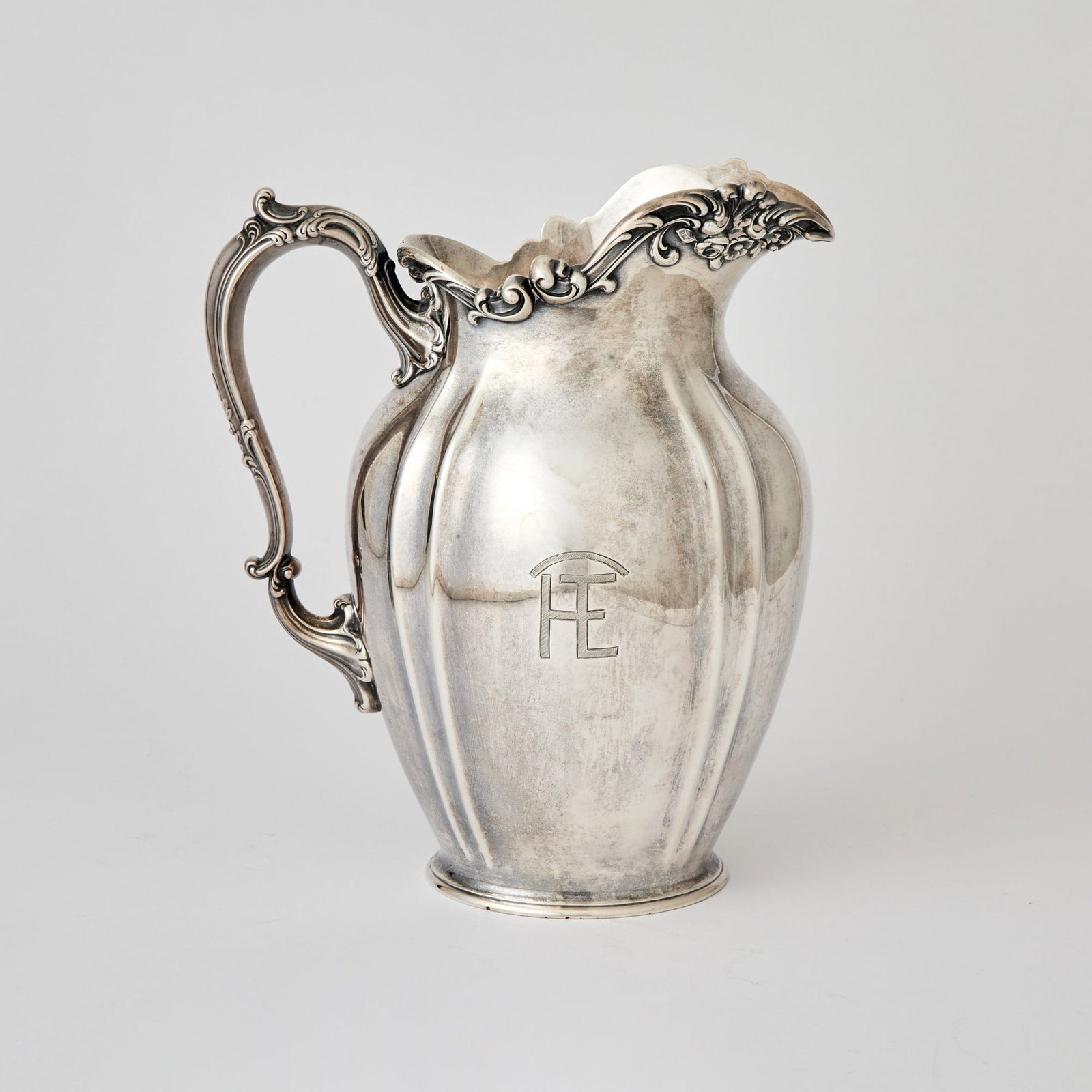 Gorham Sterling Silver Water Pitcher: First quarter 20th century Height 9 3/4 inches, approximately 25 ounces.