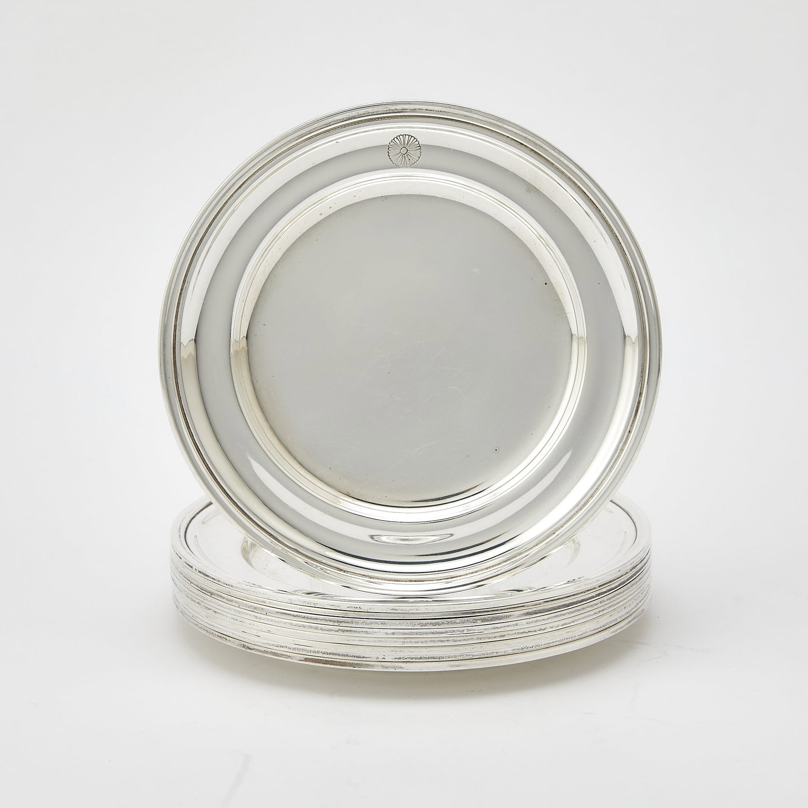 Set of Nine Mexican Sterling Silver Bread Plates: Tane, mid 20th century Diameter 6 1/4 inches, total approximately 57 ounces.