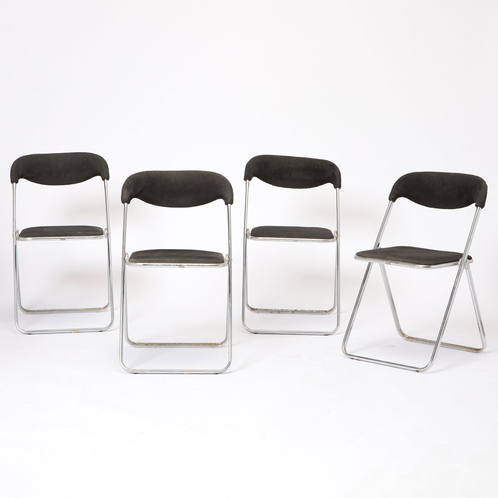 Set of Four Chrome Folding Side Chairs: Height 31 1/2 inches, width 19 inches, depth 17 inches.