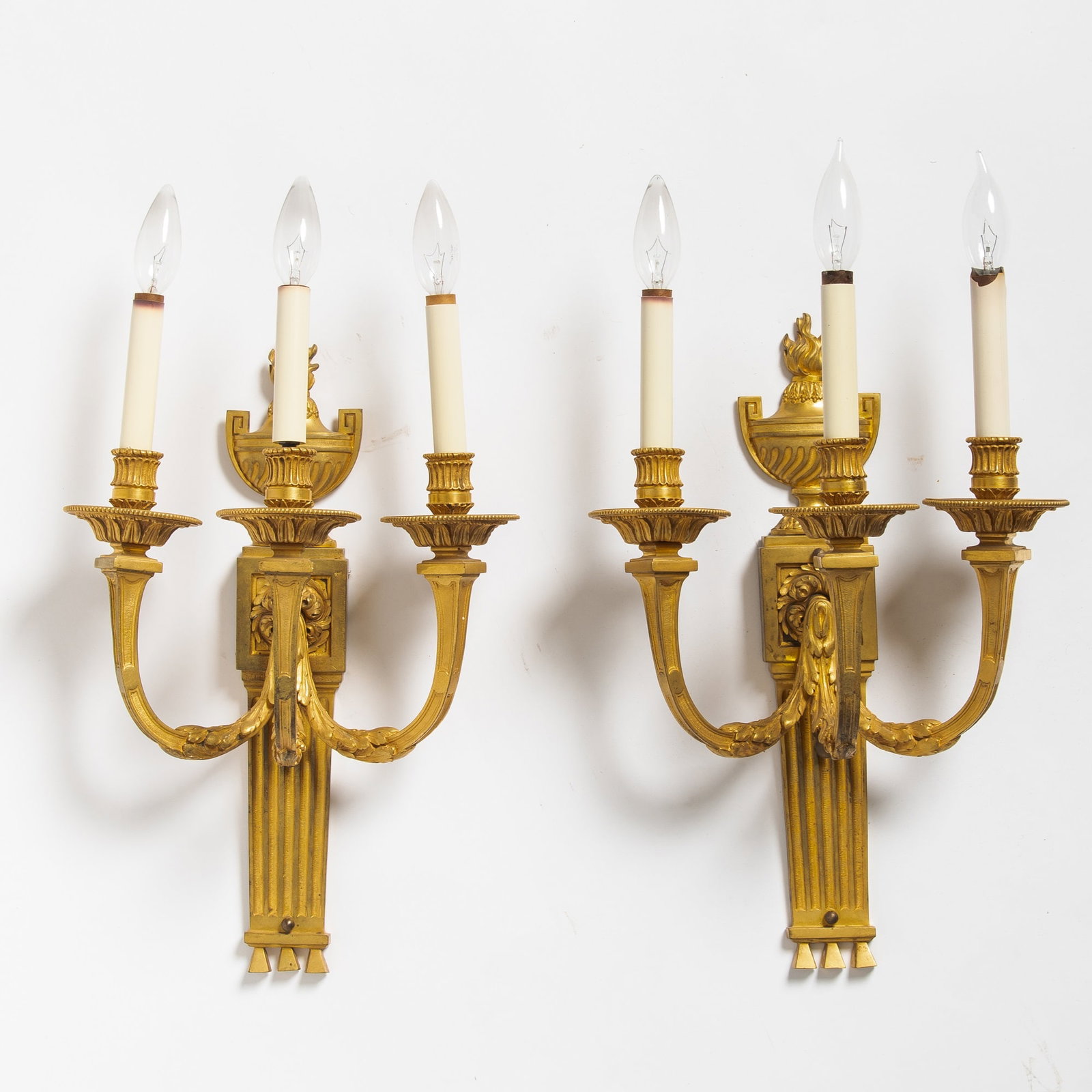 Pair of Louis XVI Style Three-Branch Gilt-Bronze Wall-Lights: 20th Century Height 21 1/2 inches, width 12 1/4 inches.
