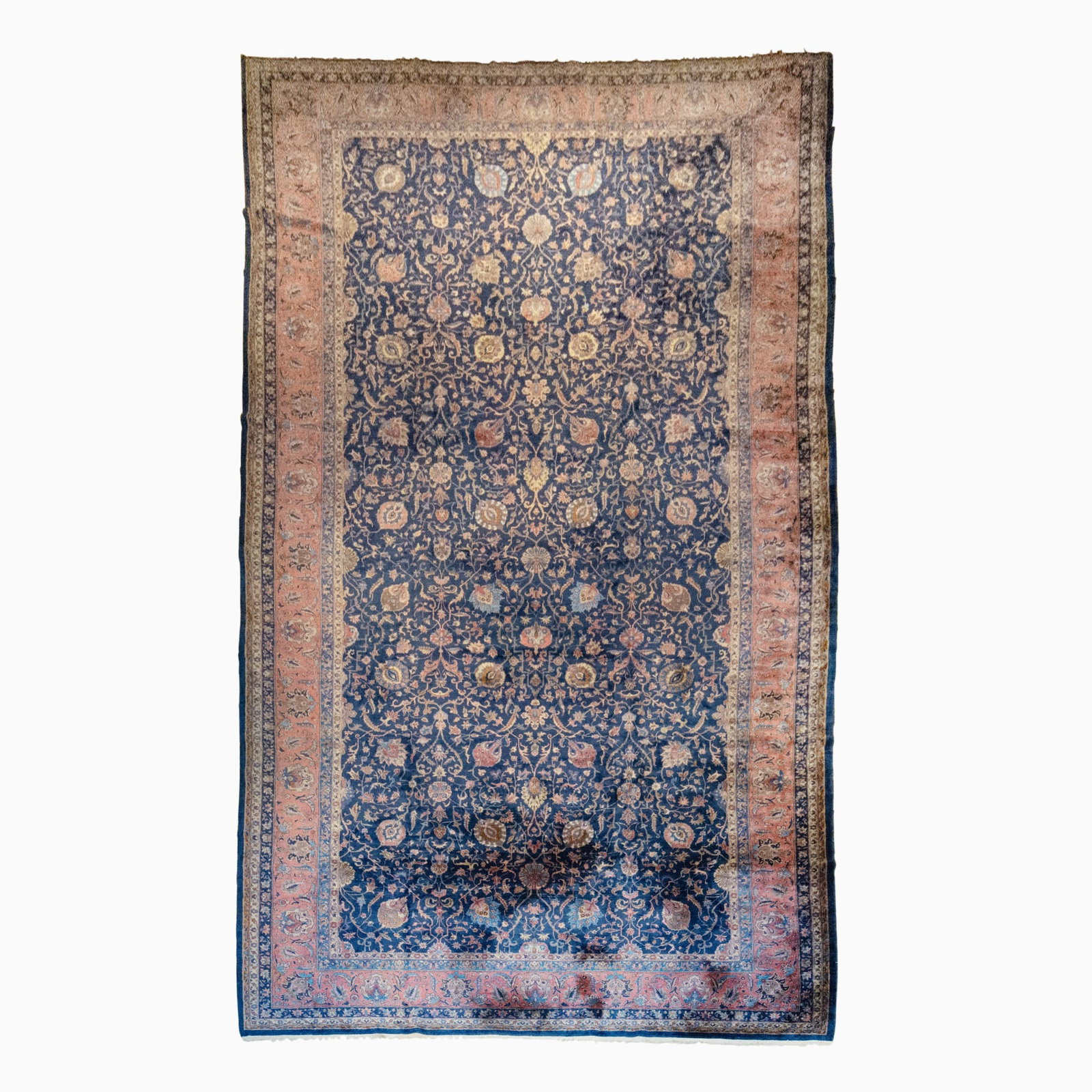 Qazvin Carpet: North Persia, circa 1935 The overall polychrome "vase" pattern on the indigo field is within a coral palmette and leafy vine border. (27' 3" x 13' 9")
