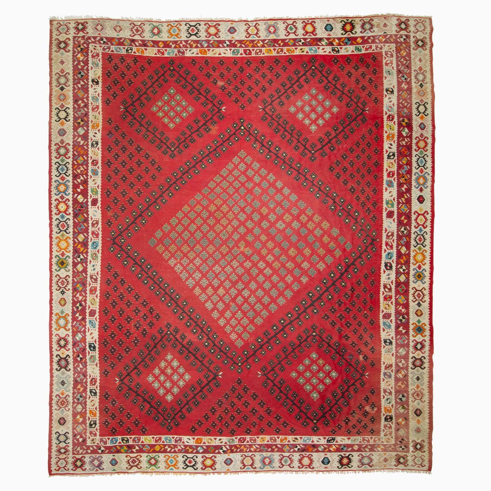 Sarkoy Kilim: West Turkey, second half 20th century The central diamond medallion flanked by four similar medallions, on a scarlet field is within an ivory stylized rosette outer border. (12' 11" x 11' 2")