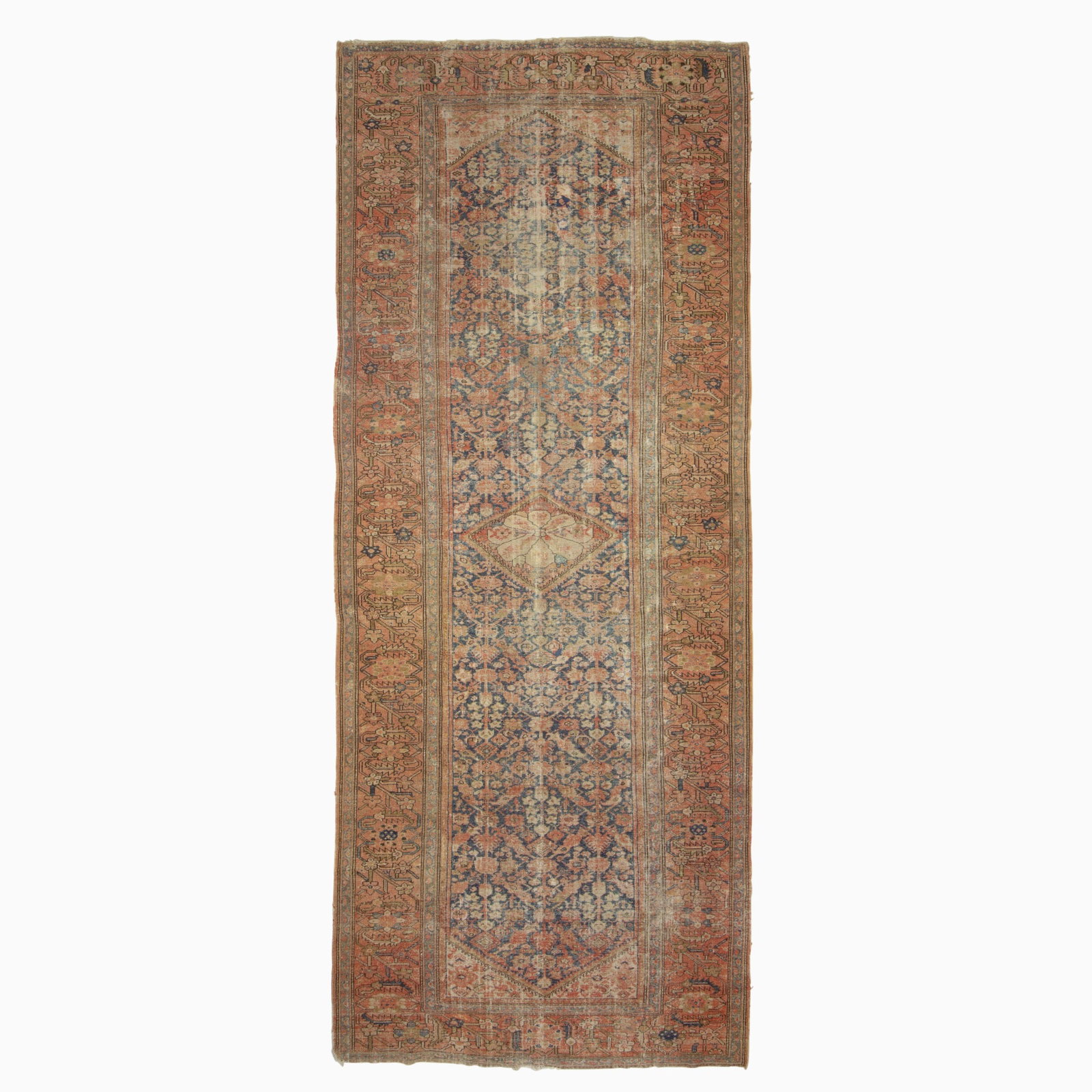 Northwest Persian Gallery Carpet: Northwest Persia, First quarter 20th century The central serrated diamond medallion on the indigo field flanked by ivory spandrels is within a rust rosette and vine border. (16' 4" x 6' 10")