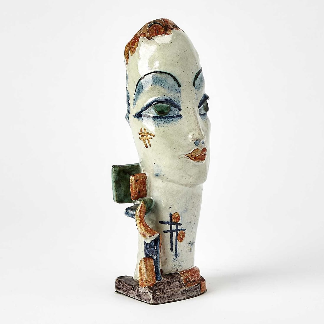 Gudrun Baudisch-Wittke: Austrian, 1907-1982 Head of a Woman Stamped WW Made in Austria GB 345 8 on the underside Painted and glazed ceramic 9 1/2 x 2 3/4 x 3 1/4 inches (24.1 x 7 x 8.3 cm)