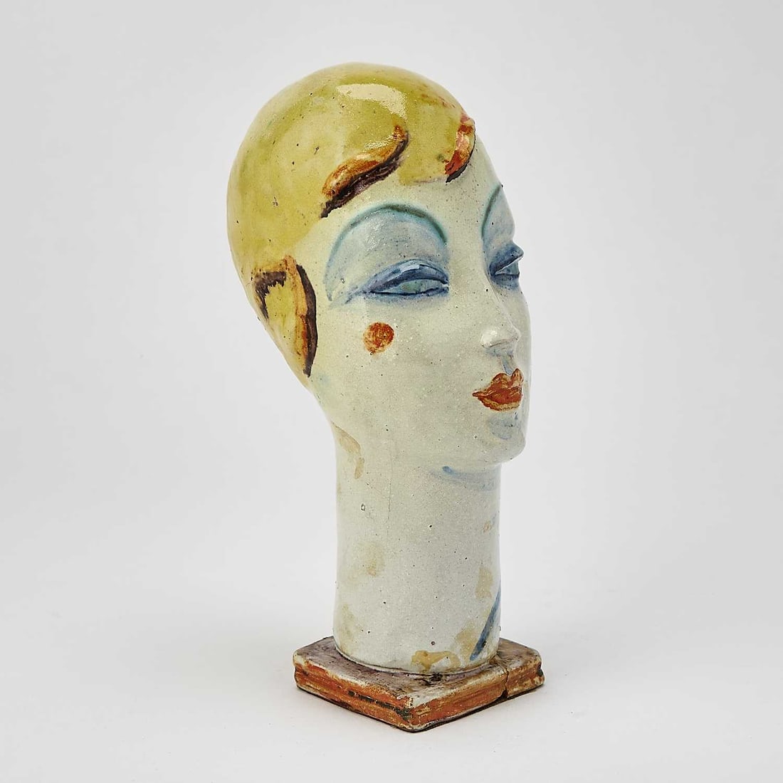 Gudrun Baudisch-Wittke: Austrian, 1907-1982 Head of a Woman with Blonde Hair Stamped WW Made in Austria GB 407(?) on the underside Painted and glazed ceramic 9 1/4 x 5 1/4 x 3 1/2 inches (23.5 x 13.3 x 8.9 cm)