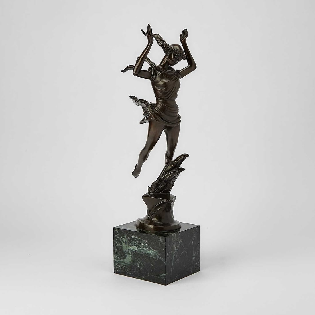 Thomas McKnight: American, b. 1941 Daphne, 1984 Signed and dated © 1984 McKnight 18/250 on the base Bronze with brown patina 19 x 5 x 4 1/2 inches including base (48.3 x 12.7 x 11.4 cm)