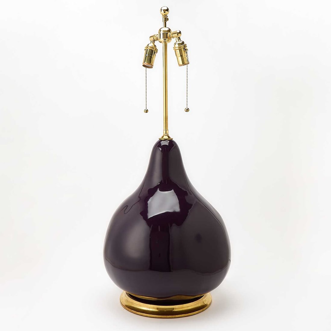Christopher Spitzmiller Large Glazed Ceramic Table Lamp: 2025 Of pear form, with a dark purple glaze, gilt-composition circular base, labeled. Height overall 33 inches; height of body 17 3/4 inches.