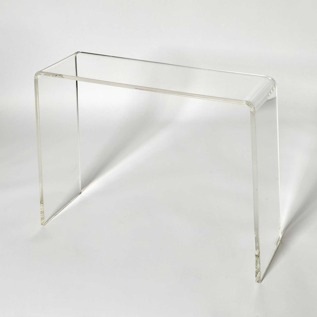 Acrylic Waterfall Console Table: Late 20th century Height 27 3/4 inches, width 33 inches, depth 9 inches.