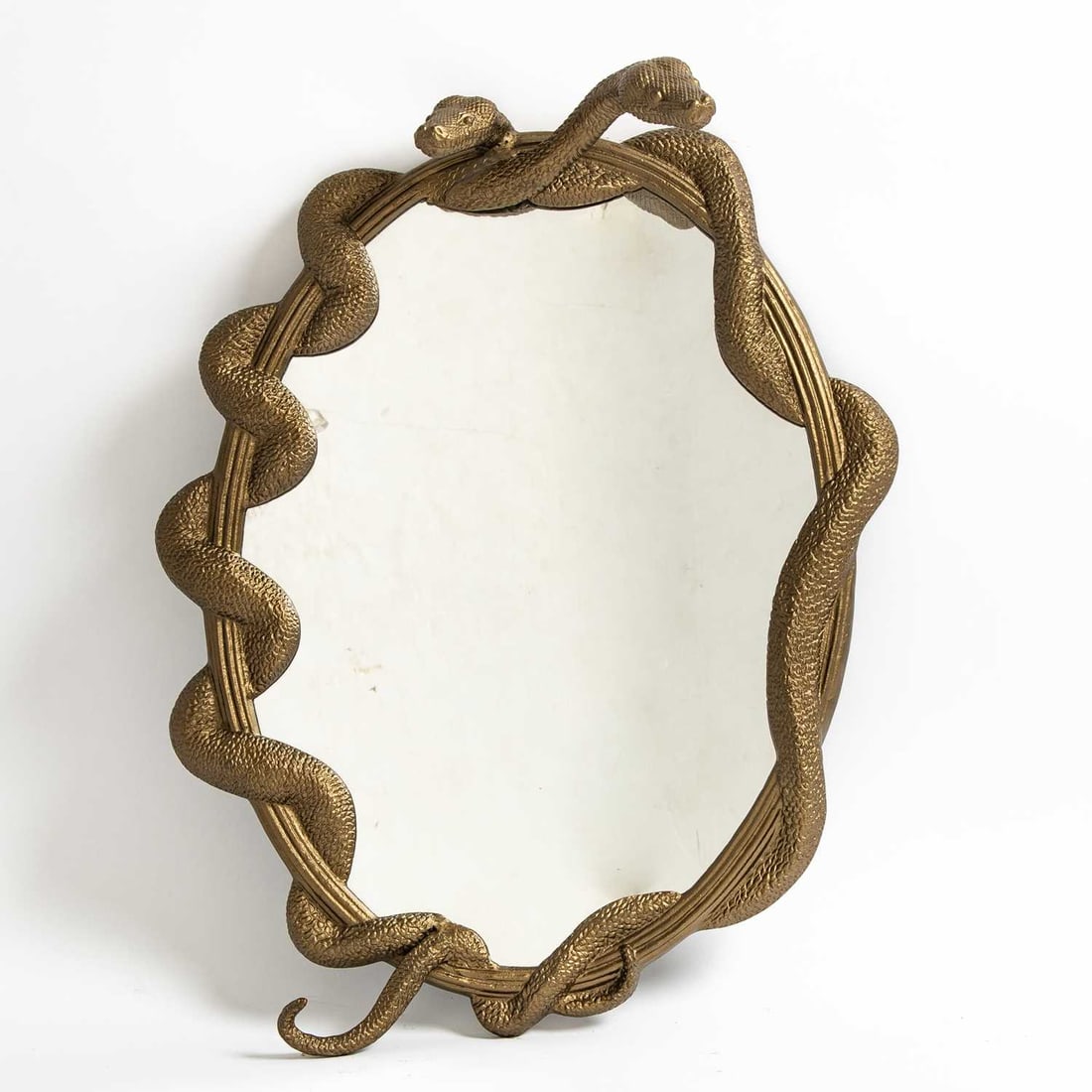 Harry Potter Cast Aluminum and MDF Snake-Form "Nagini" Wall Mirror: Wizarding World, 21st century Height 28 1/2 inches, width 22 inches.