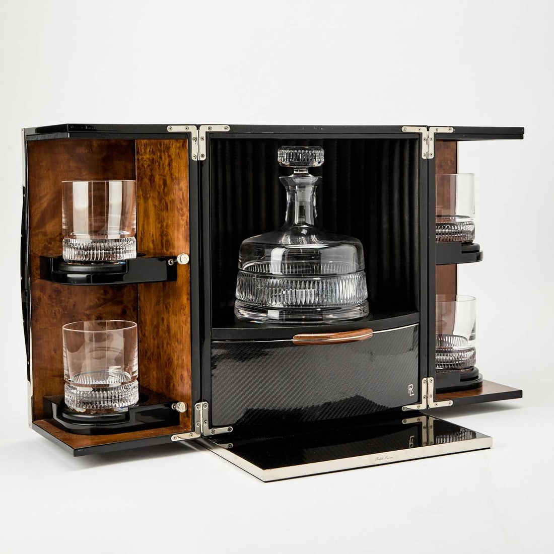Ralph Lauren Lacquered Engineered Wood and Polished Stainless Steel "Paxton Mixology Box": Circa 2018 In the Art Deco style, the exterior sides of the box with a piano black finish, the pair of hinged doors opening to reveal a walnut interior and various bar accessories, comprising a cut