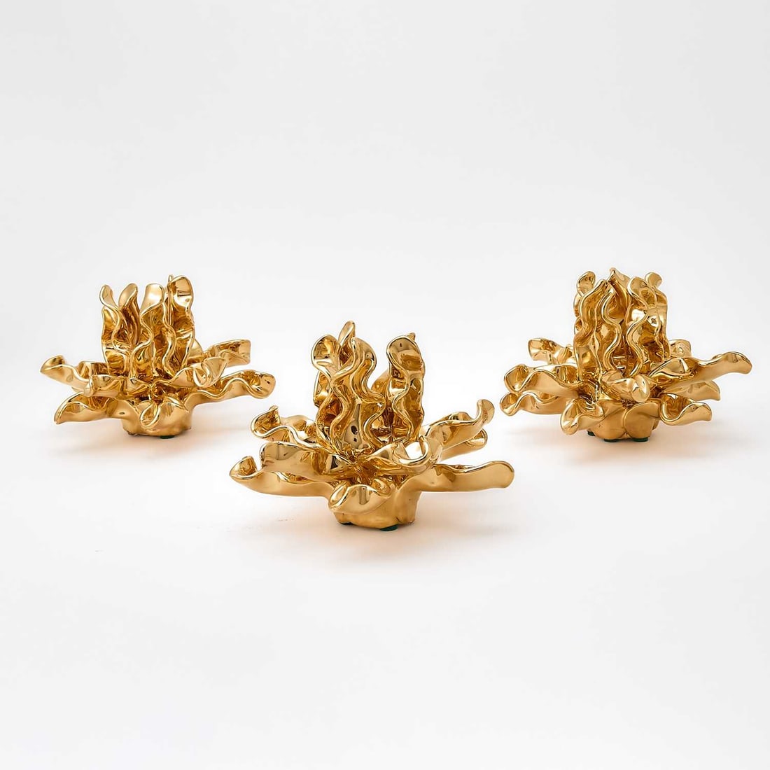 Three Jean Roger Hand-Made Gold Glazed Earthenware "Seaweed" Candle Holders: Created by Francois Roger, 2016 Each impressed JEAN ROGER. Height 4 3/8 inches. Provenance: KRB NYC.
