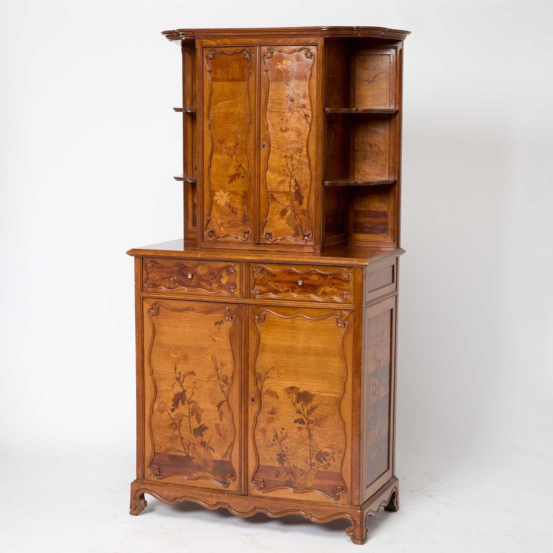 French Art Nouveau Inlaid Woods Cabinet: Late 19th century Height 6 feet 6 1/2 inches, width 41 inches, depth 20 3/4 inches. Provenance: Doyle New York, March 11, 2026, lot 116