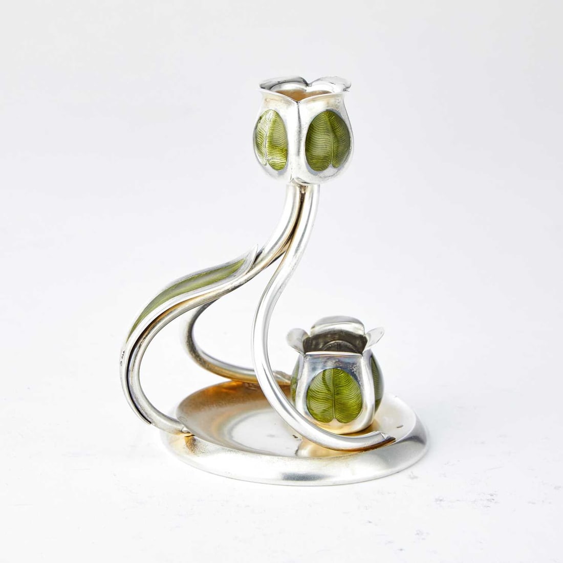 Austrian Jugenstil Silver and Enamel Chamberstick: Georg Adam Scheid, Vienna, early 20th century With a floriform candleholder with scrolling supports and circular base. Height 4 1/2 inches, approximately 4 ounces, all in. A similar candlestick by Sch