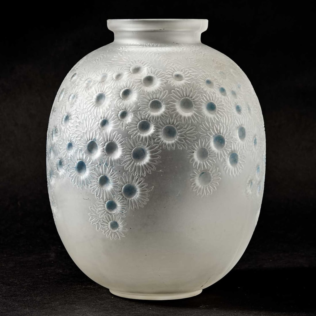 R Lalique Molded Glass "Marguerites" Vase: Marcilhac no. 922, circa 1923-47 Of ovoid form, with a short striaght neck and circular mouth, in colorless glass, heightened with blue patina, molded with stylized daisy blossoms, in low relief, with