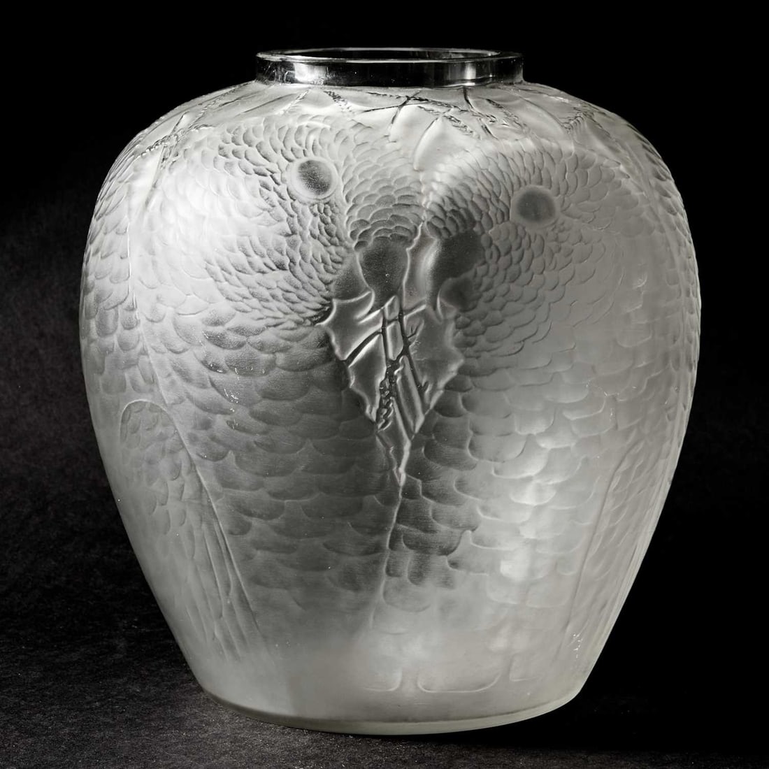 R. Lalique Molded Glass "Alicante" Vase: Marcilhac no. 998, circa 1927-47 Of tapering ovoid form, in colorless glass, molded with a thrice repeating motif of confronting parakeet heads, satin finish, engraved script signature R. Lalique Fran