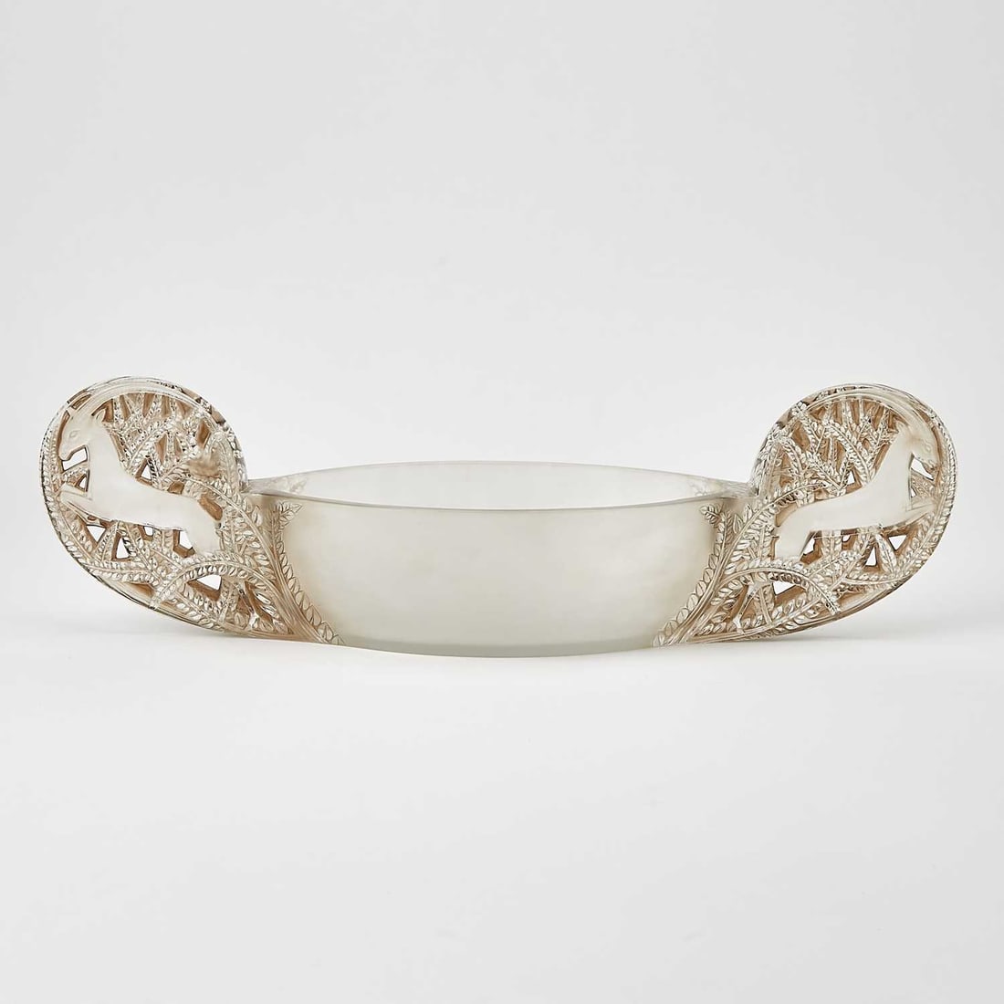 R. Lalique Molded Glass "Saint-Hubert" Two-Handled Jardiniere: Also called Gazelles, Marcilhac no. 3461, circa 1927-47 Of boat form, in colorless glass, heightened with sepia patina, each pierced ear-shaped handle molded with a leaping gazelle, satin and glossy f