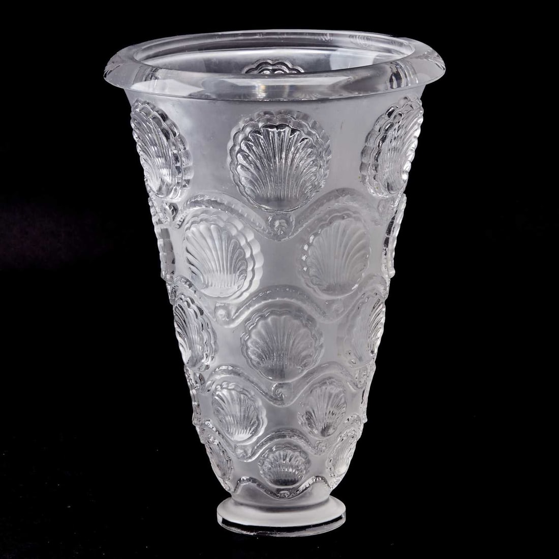 R. Lalique Molded Glass "Cancale" Vase: Marcilhac no. 10-938, model introduced 1942, this example circa 1942-51 Of conical form, in colorless glass, molded with five rows of graduated stylized shell motifs, in intaglio relief, arranged with