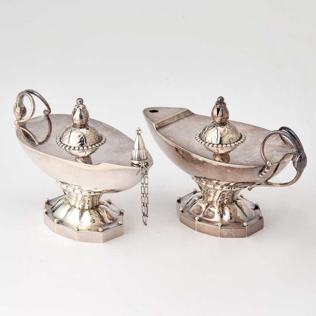 Pair of Georg Jensen Sterling Silver Cigar Lamps: Pattern #12, post 1945 Height 3 1/2 inches, length 5 inches, total approximately 10 ounces.