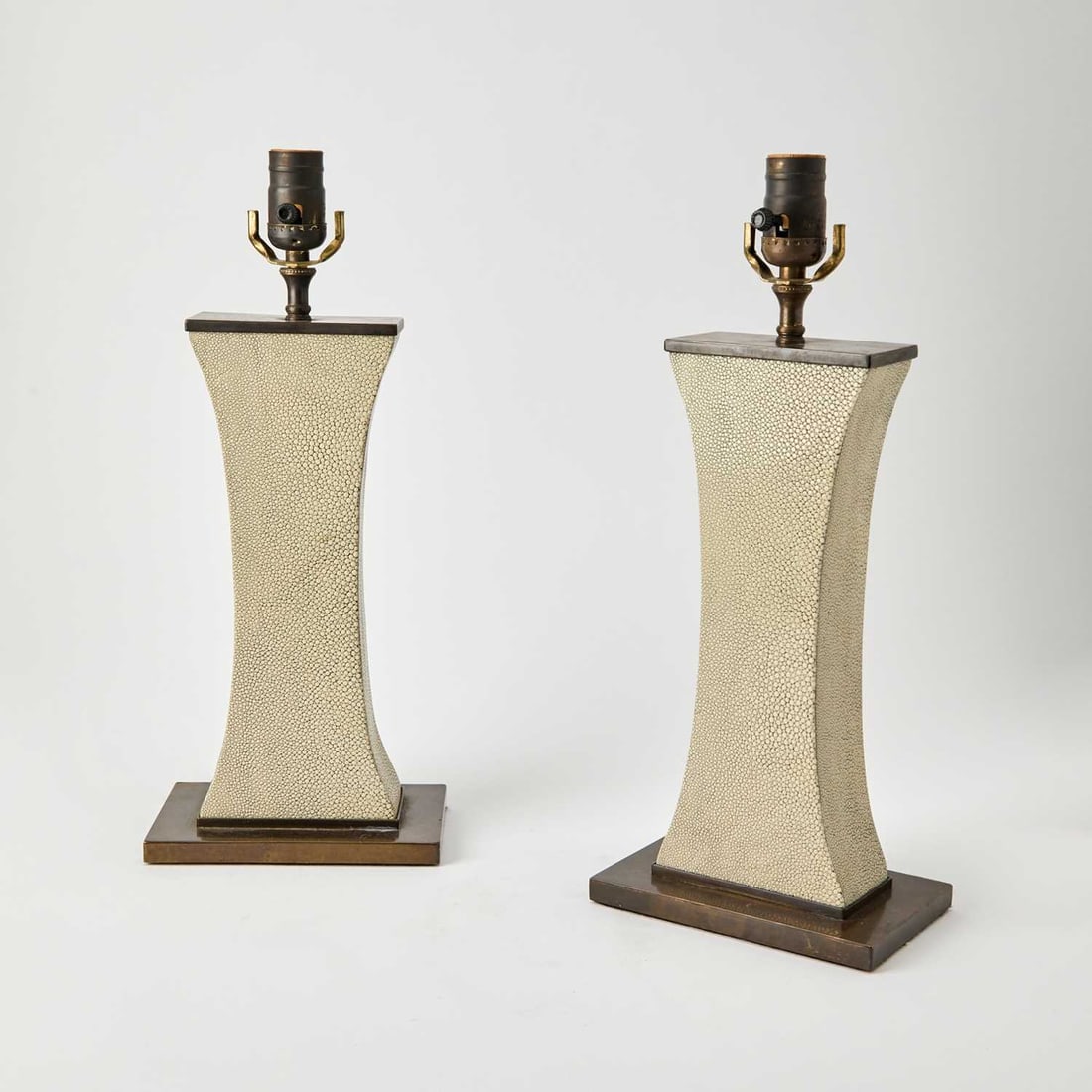 Pair of Atelier Petite Art Deco Style Shagreen Table Lamps: 21st Century Each of waisted rectangular form, with bronze patinated metal mounts, with an associated string shade, base ummarked. Height overall 22 1/4 inches; height of body 12 inches; height of sha