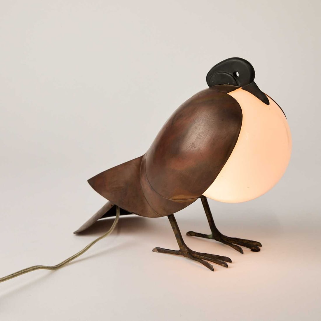 Francois-Xavier Lalanne Patinated Bronze, Copper and Glass "Lampe Pigeon": Designed circa 1991 Impressed on the tail feather ARTCURIAL and numbered 347/900, also inscribed fxl. Height 8 1/2 inches, width 5 inches, depth 10 3/8 inches.