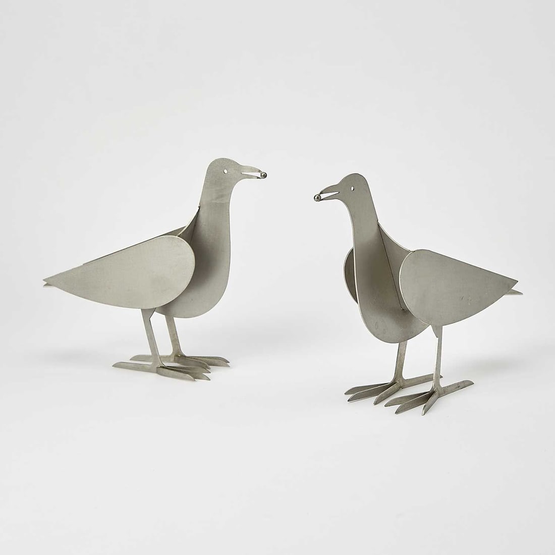 Pair of Francois-Xavier Lalanne Aluminum "L'Oiseau d'Argent" Candle Holders: Circa 1990 Each inscribed fxl and impressed LALANNE and ARTCURIAL. Height 6 3/4 inches, width 3 inches, depth 7 3/4 inches.