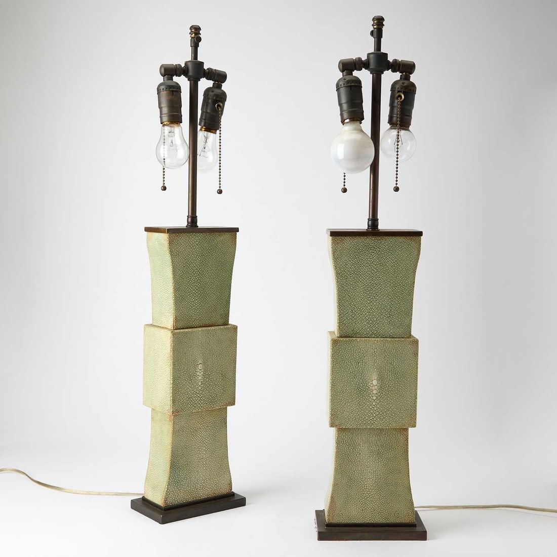 Pair of Art Deco Style Shagreen Table Lamps: Last quarter 20th century Each of flattened form, with patinated metal mounts, unmarked. Height of body 16 3/4 inches.