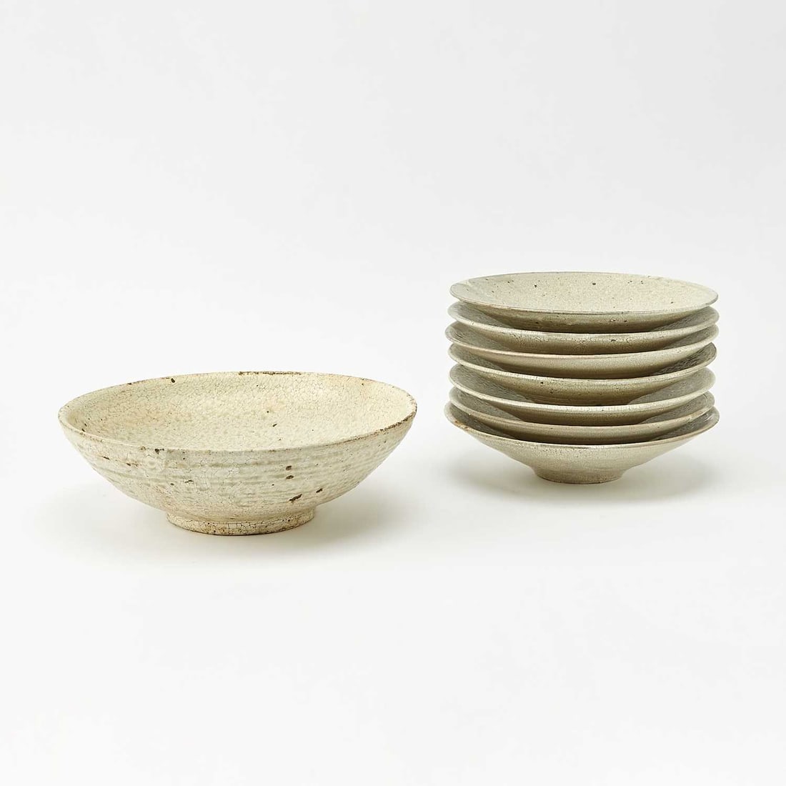 Eight Japanese Studio Ceramic Bowls: Aso Kojima, 21st Century Comprising seven bowls and a larger bowl. Diameters 8 3/4 and 10 inches. Provenance: Kaikai Kiki Gallery, Tokyo