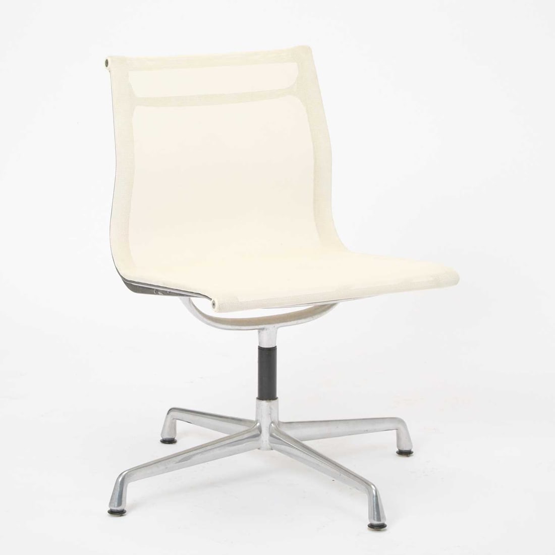 Charles and Ray Eames for Herman Miller Aluminum and Mesh "Aluminum Group" Office Chair: Later reiusse Height of back 33 1/4 inches, height of seat 18 1/4 inches, width 21 inches, depth 18 inches.
