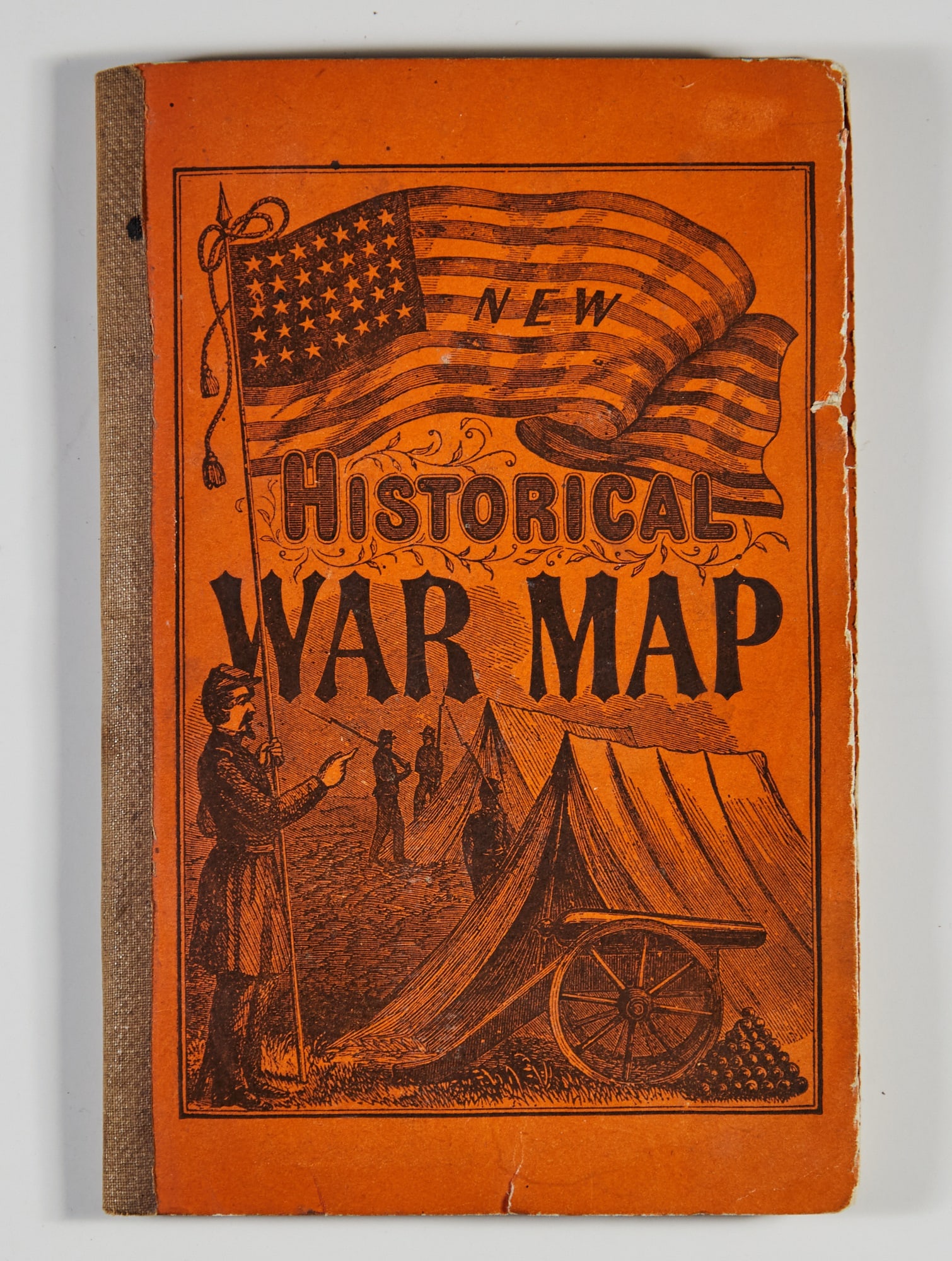 Large hand-colored folding map of the Border and Southern States from 1864: [CIVIL WAR] New Historical War Map. New York: Phelps & Watson, 1864. Orange stiff paper covers, tan cloth spine. 7 x 4 1/2 inches (18 x 11.5 cm), folding map 25.5 x 36 (65 x 91 cm); 32 pp text, li