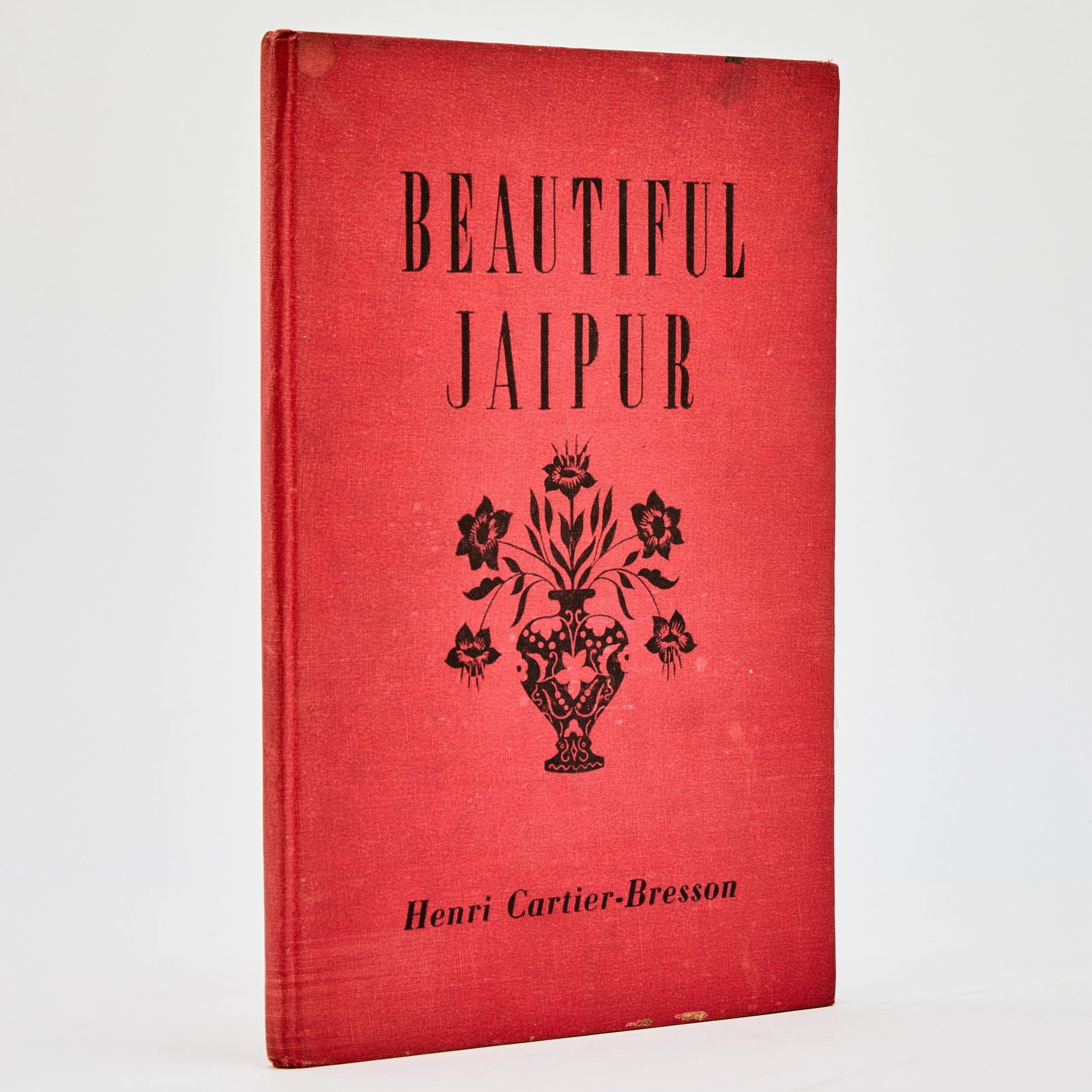Henri Cartier-Bresson's first book: [CARTIER-BRESSON, HENRI] Beautiful Jaipur. [The Times of India Press, Bombay, 1948]. First edition. Publisher's red cloth with design in black. 9 3/4 x 6 1/2 inches