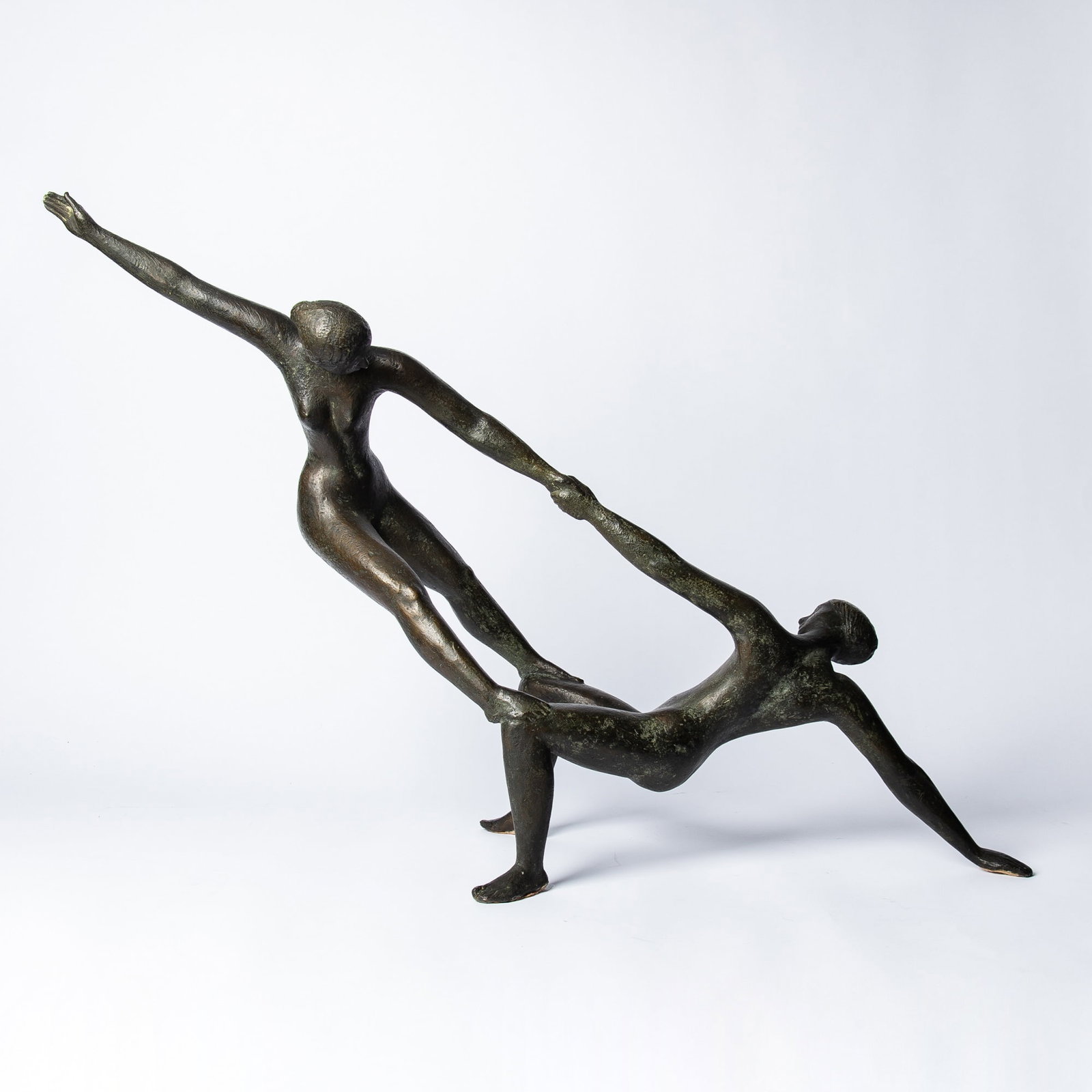 Karl Heinz Krause: German, 1924-2019 Artistinnen III Monogrammed, with numbers 57/63 Bronze with a dark brown patina 22 1/2 x 32 x 9 3/4 inches (57.1 x 81.3 x 24.8 cm)