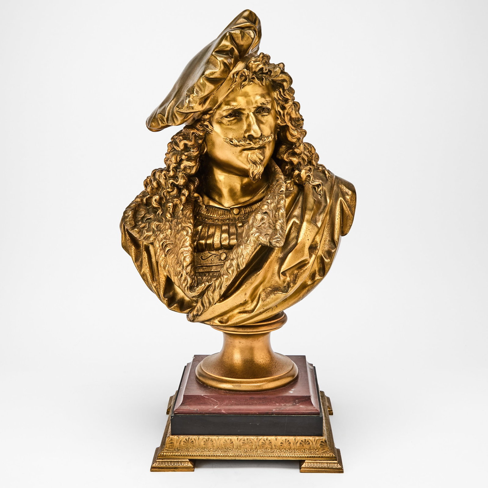 French Gilt-Bronze Bust of Rembrandt van Rijn: Cast after a model by Albert-Ernest Carrier-Belleuse (1824–1887), circa 1900 Finely cast, wearing a soft beret with curling hair to his shoulders, the face modeled with a mustache and pointed go