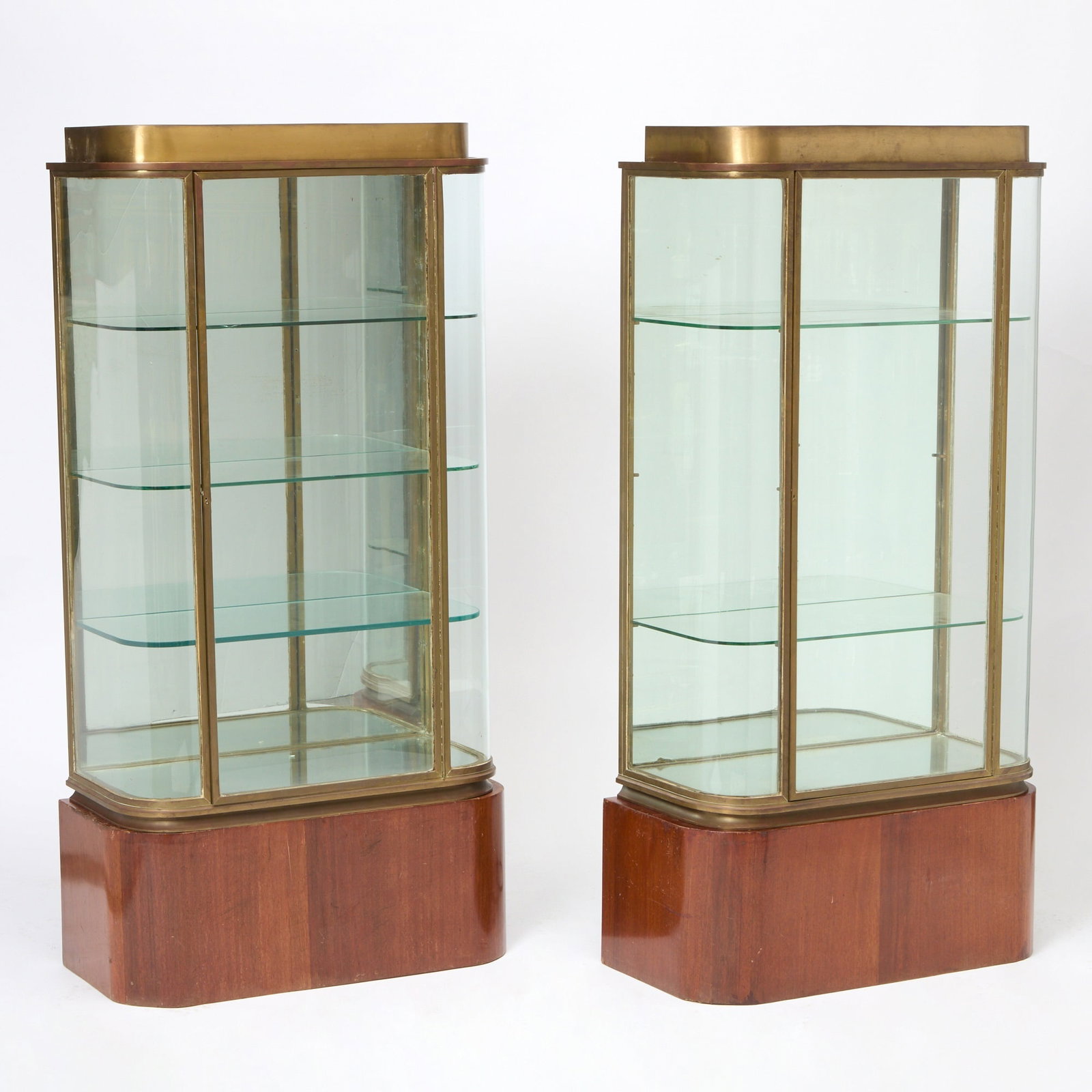 Pair of Art Deco Style Bronze and Mahogany Vitrines: Mid-20th century Height 55 inches, width 30 inches, depth 14 1/2 inches.