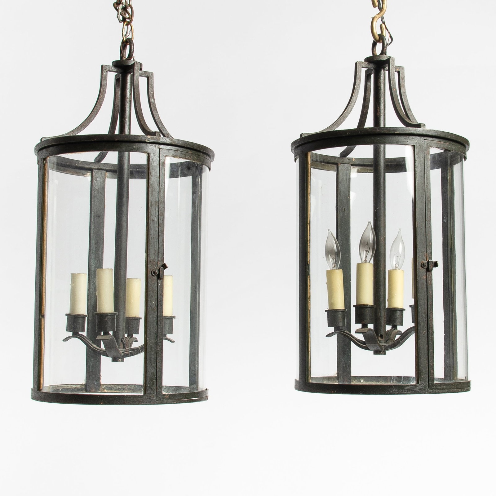 Pair of Blackened Iron and Glass Hall Lanterns: Height 24 inches, diameter 12 inches. Provenance: Bernd Goeckler Inc.