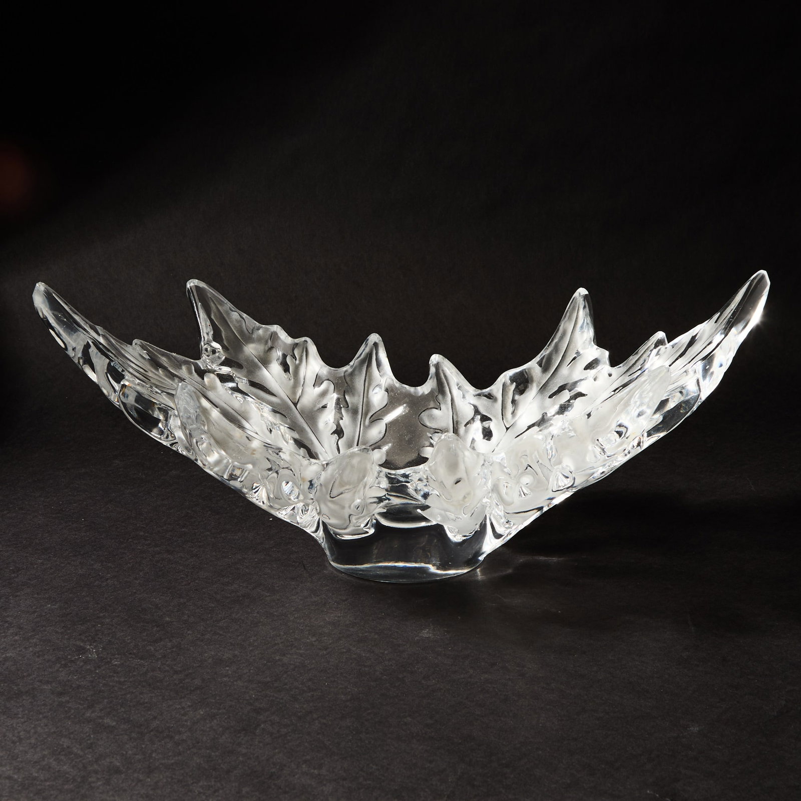 Lalique Molded Glass Champs-Elysees Bowl: Late20th/early 21st century Of shallow form, modeled as two opposed stylized maple leaves, in colorless glass, satin and glossy finish, engraved Lalique France. Height 7 1/4 inches, width 18 inches.