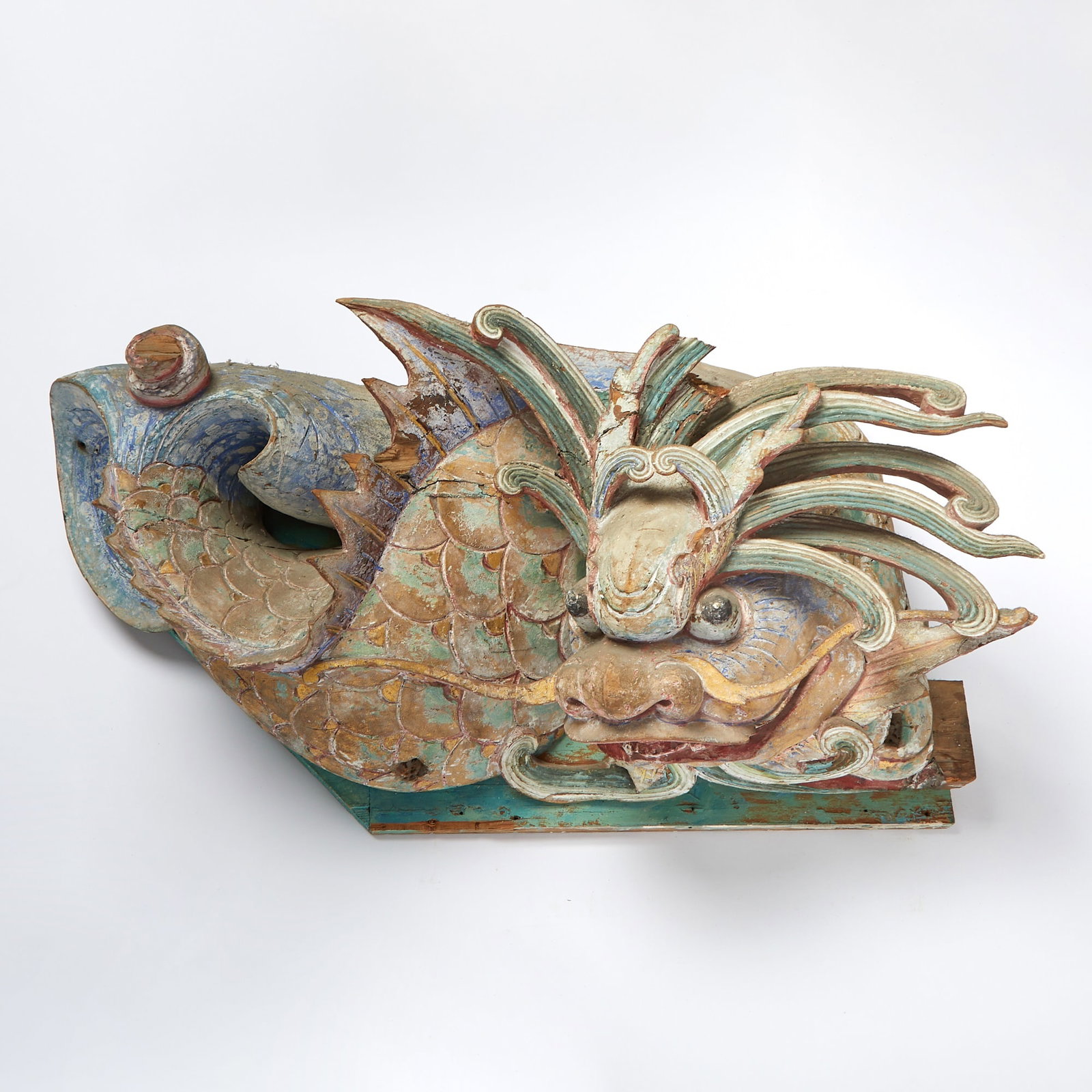 Southeast Asian Painted Wood Figure: Carved to show a coiling dragon. (Length 31 inches)